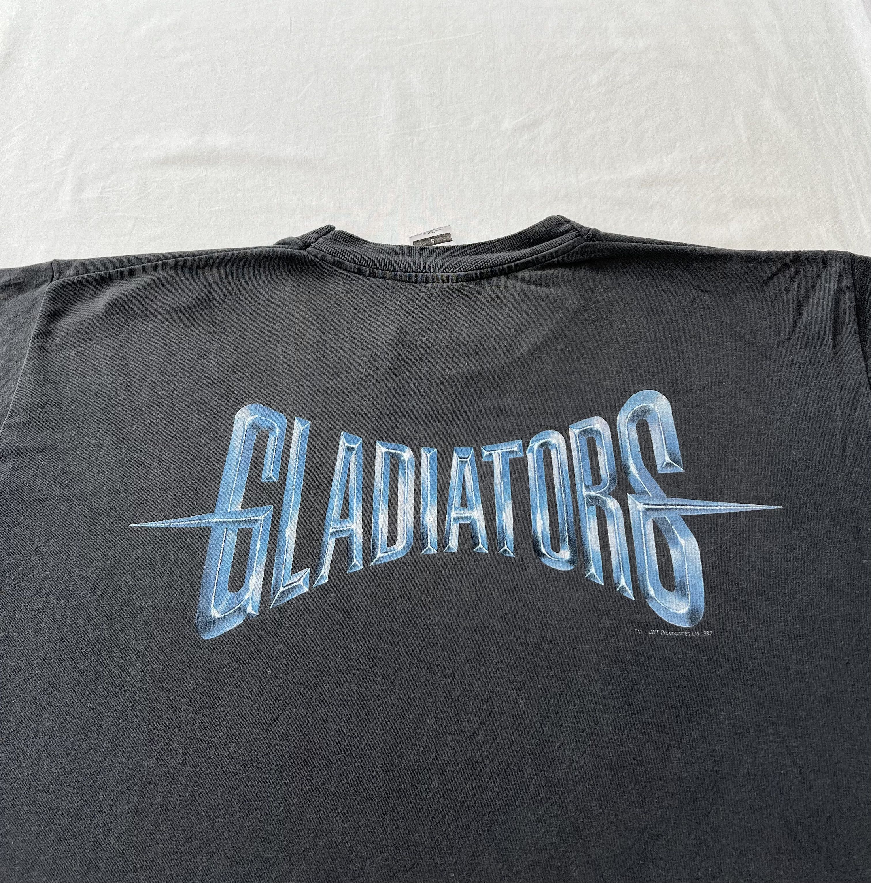Vintage Vintage 1992 Gladiators TV Show British BBC Faded Black Tee Size US L / EU 52-54 / 3 - 11 Thumbnail
