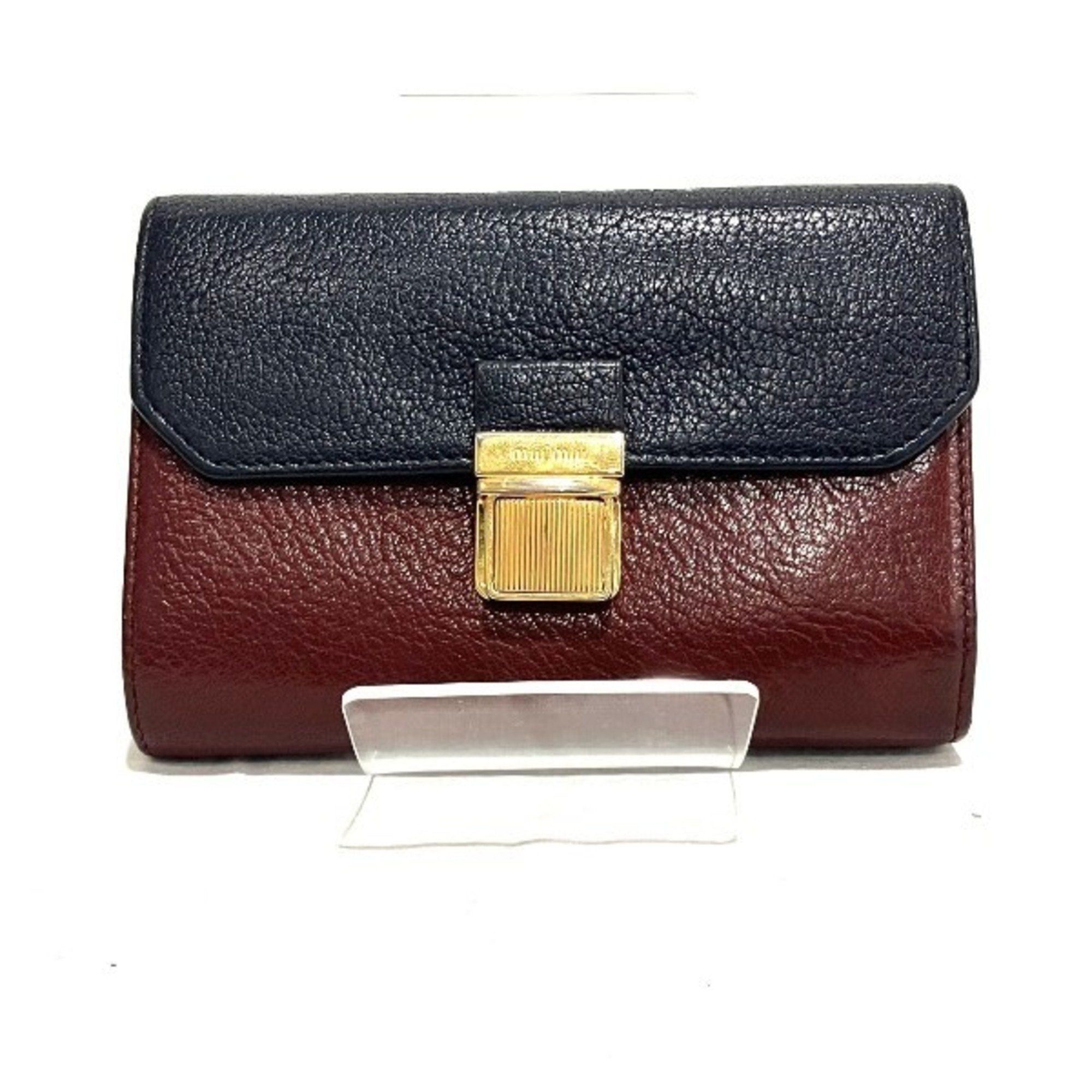 image of Miu Miu Miu Madras Bicolor L-Shaped Tri-Fold Wallet For Women in Black