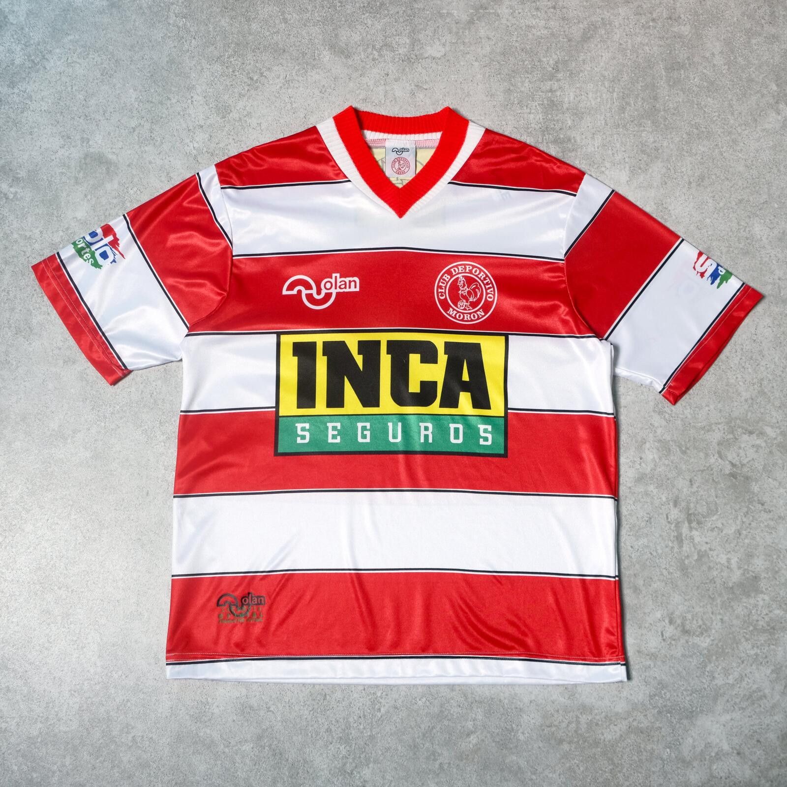 Valentino Orlandi 1995/96 Deportivo Morón (Argentina) Home Shirt Olan (L) Size US L / EU 52-54 / 3 - 1 Thumbnail