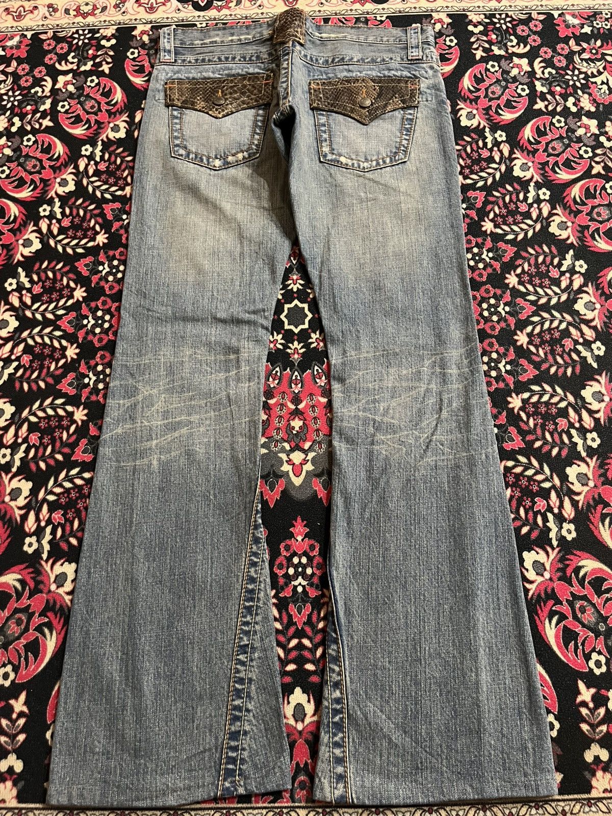 Semantic Design Snake Flaps Pocket Distressed Flare Jeans