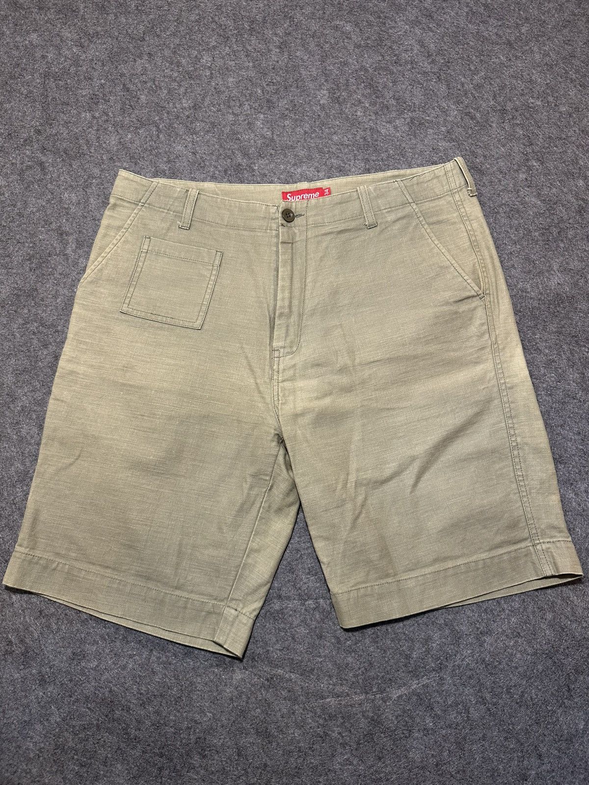 vintage olive cotton Supreme field shorts.