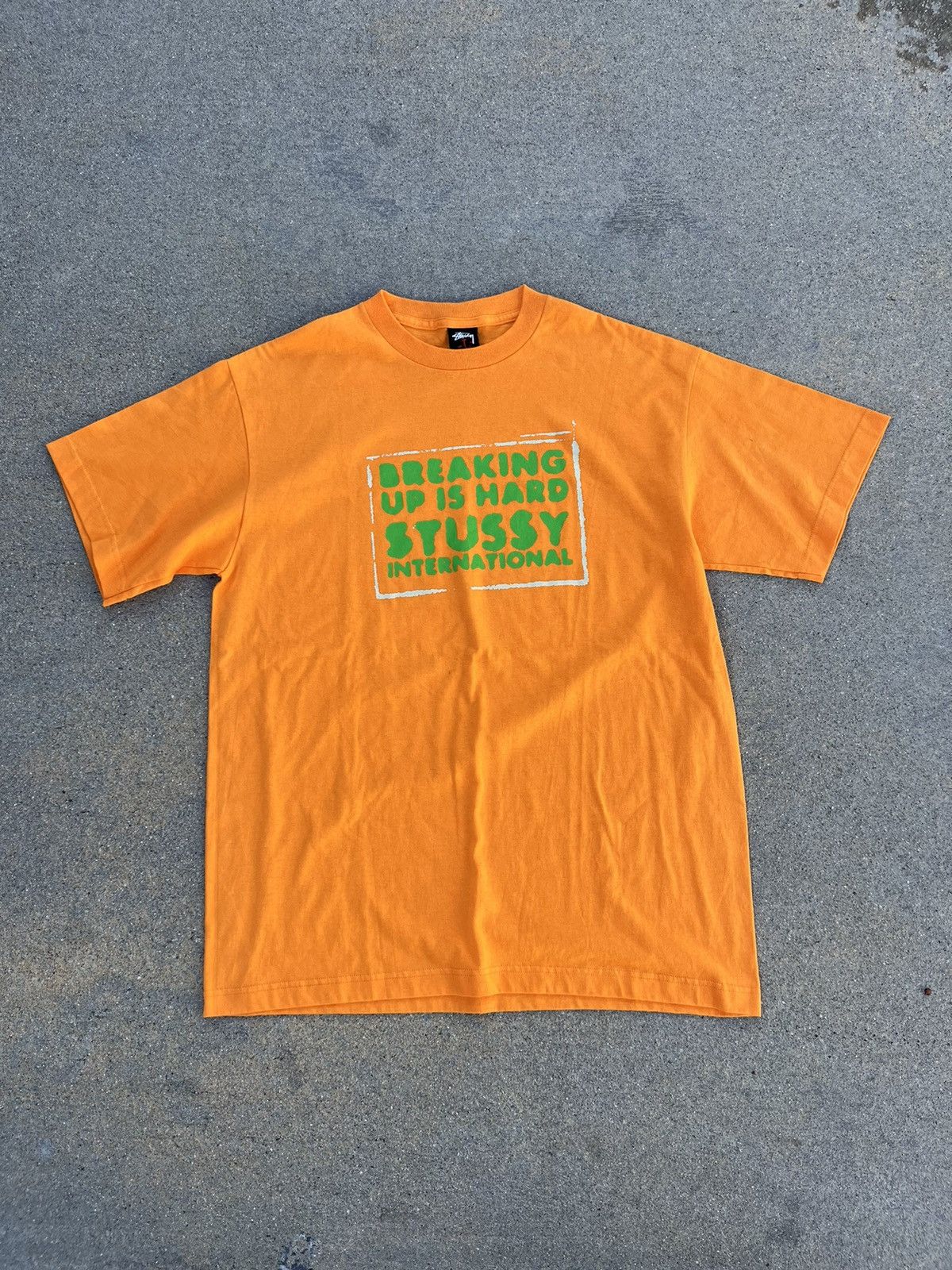 image of Vintage Stussy Breakup T Shirt in Orange, Men's (Size XL)