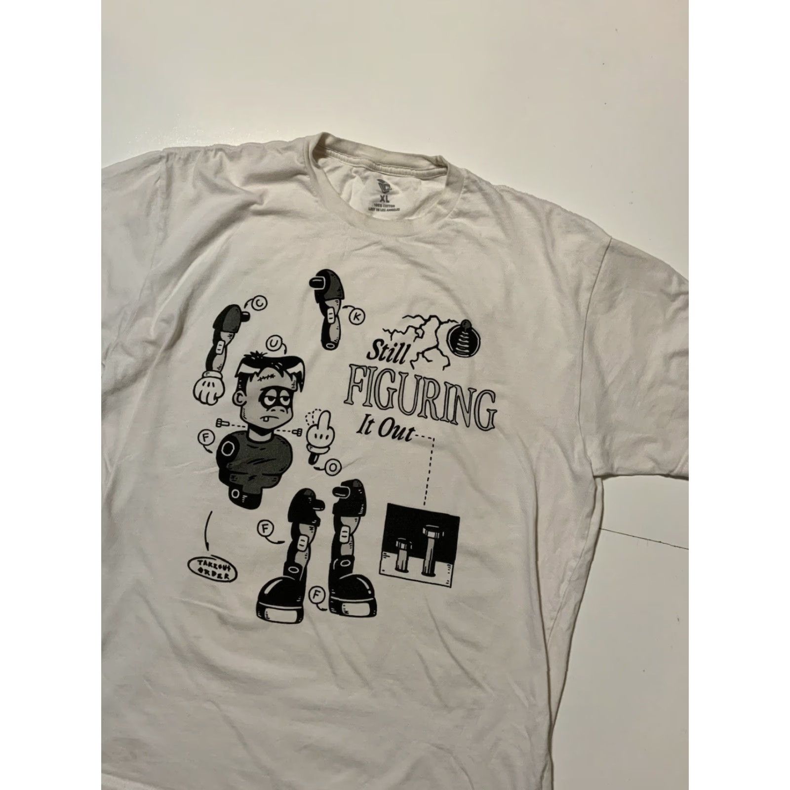Vintage VINTAGE Lost In Los Angeles Frankenstein Still Figuring It Out Graphic S/S T-Shirt XL Mens White 50 Chest 30 Shoulder to Hem Size US XL / EU 56 / 4 - 4 Thumbnail