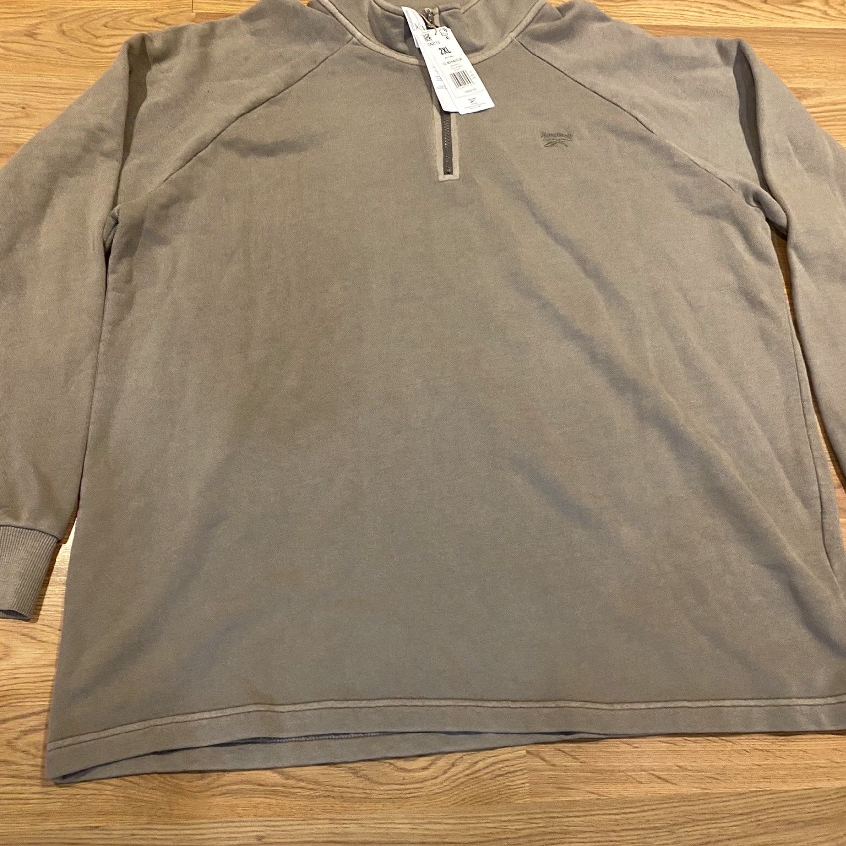 Reebok **NWT Reebok 2XL Men’s Brown 1/4 Zip Pullover Sweatshirt** User: NWT Reebok 2XL Men’s 1/4 Zip Brown Pullover Sweatshirt Size US XXL / EU 58 / 5 - 4 Thumbnail
