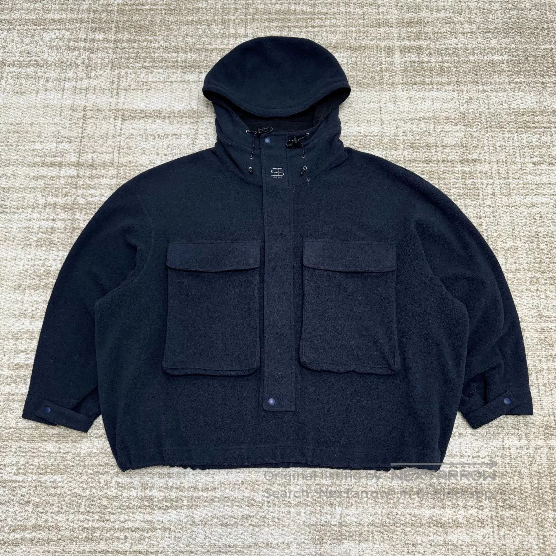 navy fleece hooded jacket with pockets.