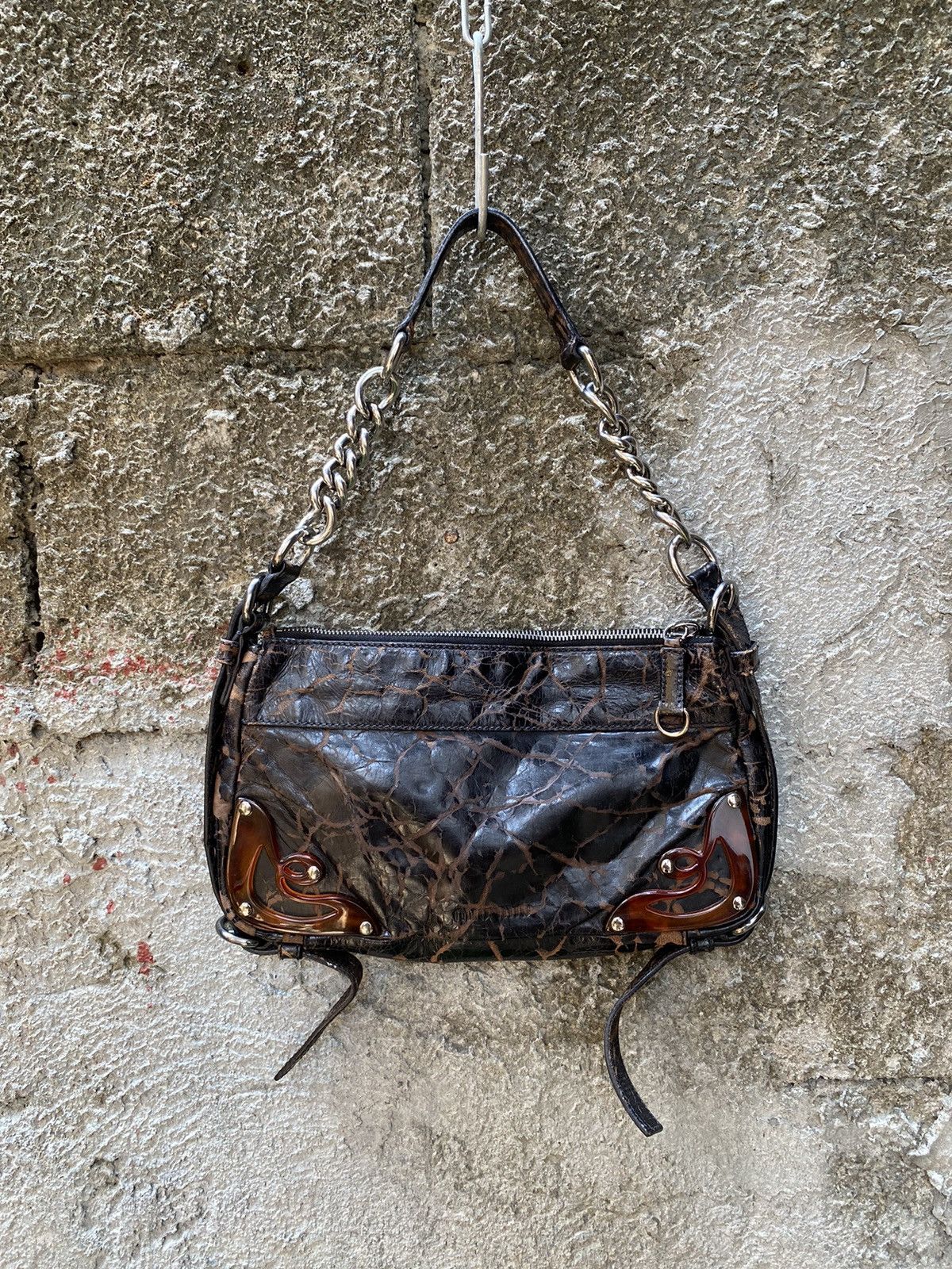 image of Miu Miu Distressed Shoulder Bag in Brown, Women's