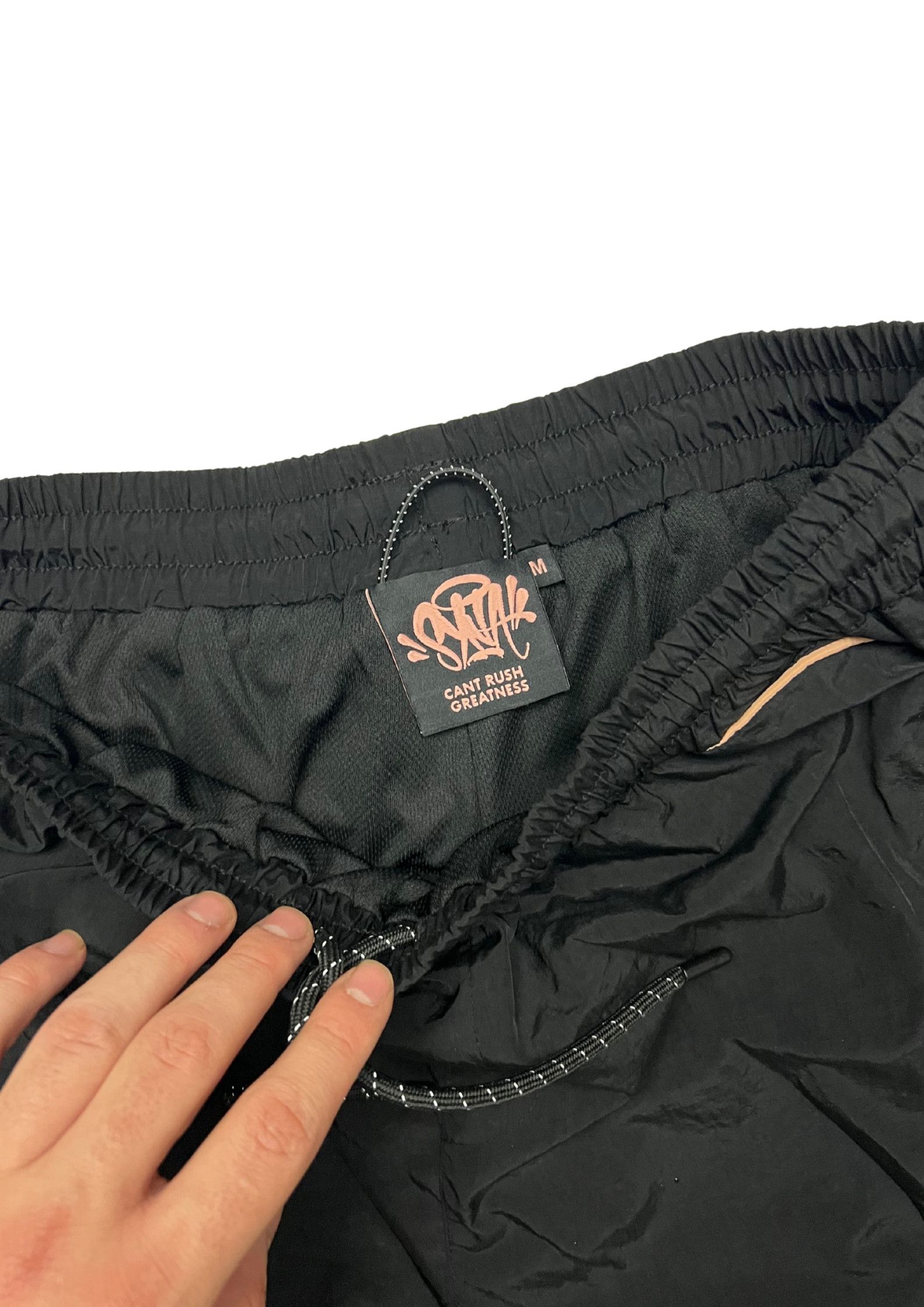 Syna World Syna World Shell Tracksuit “BLACK / GOLD” CHECK Description Size US S / EU 44-46 / 1 - 9 Thumbnail