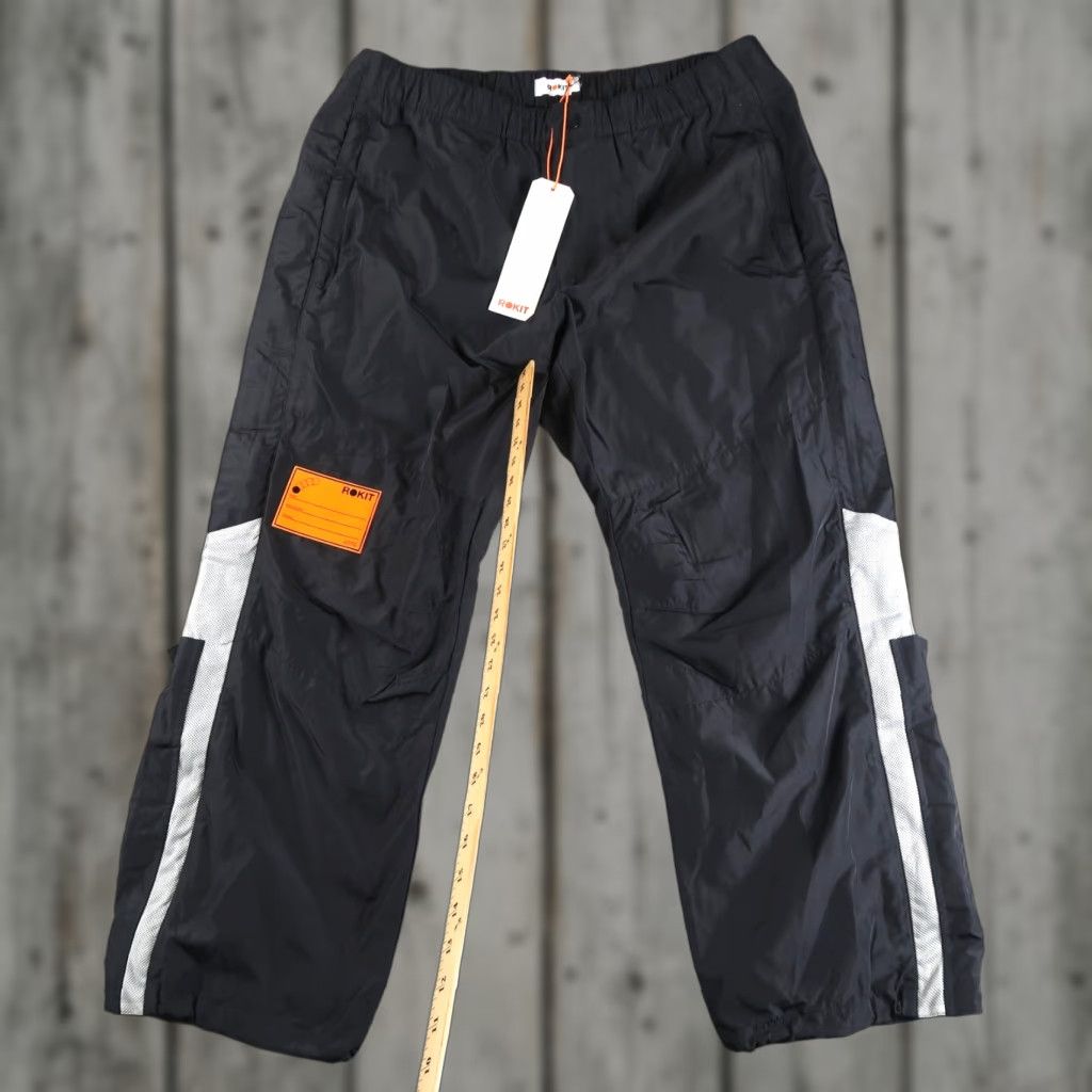 Vintage ROKIT Mens Windbreaker Pants Size L Side Zip Pockets Black Polyester Sports Size US 33 - 1 Thumbnail