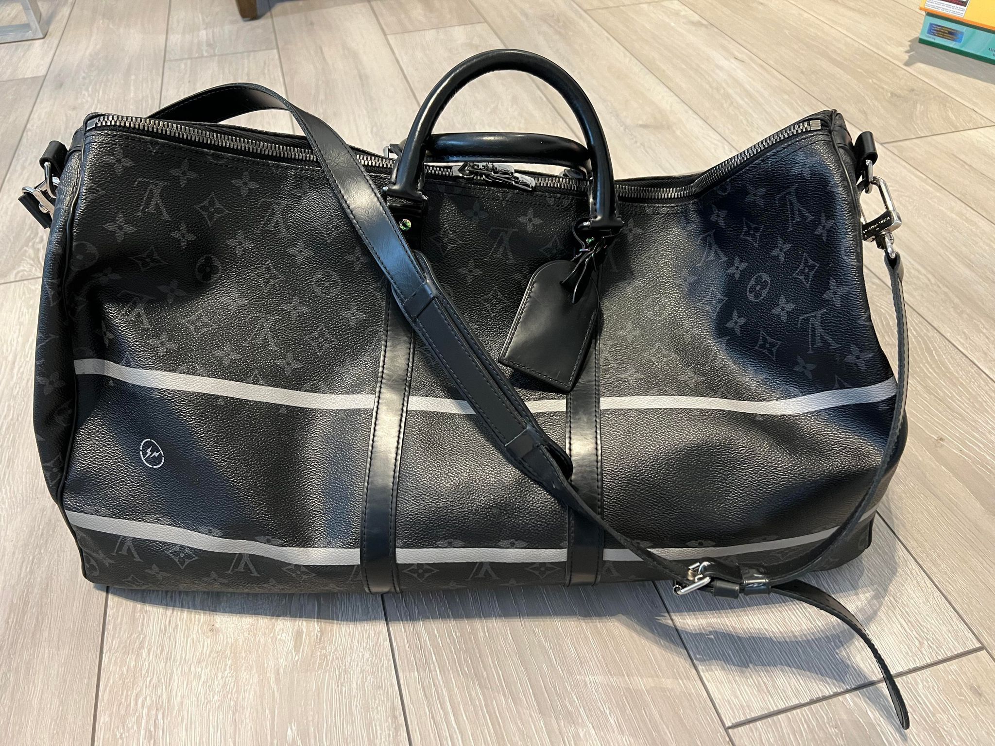 image of Louis Vuitton Monogram Eclipse Keepall Bandouliere 55 in Black/Grey, Men's