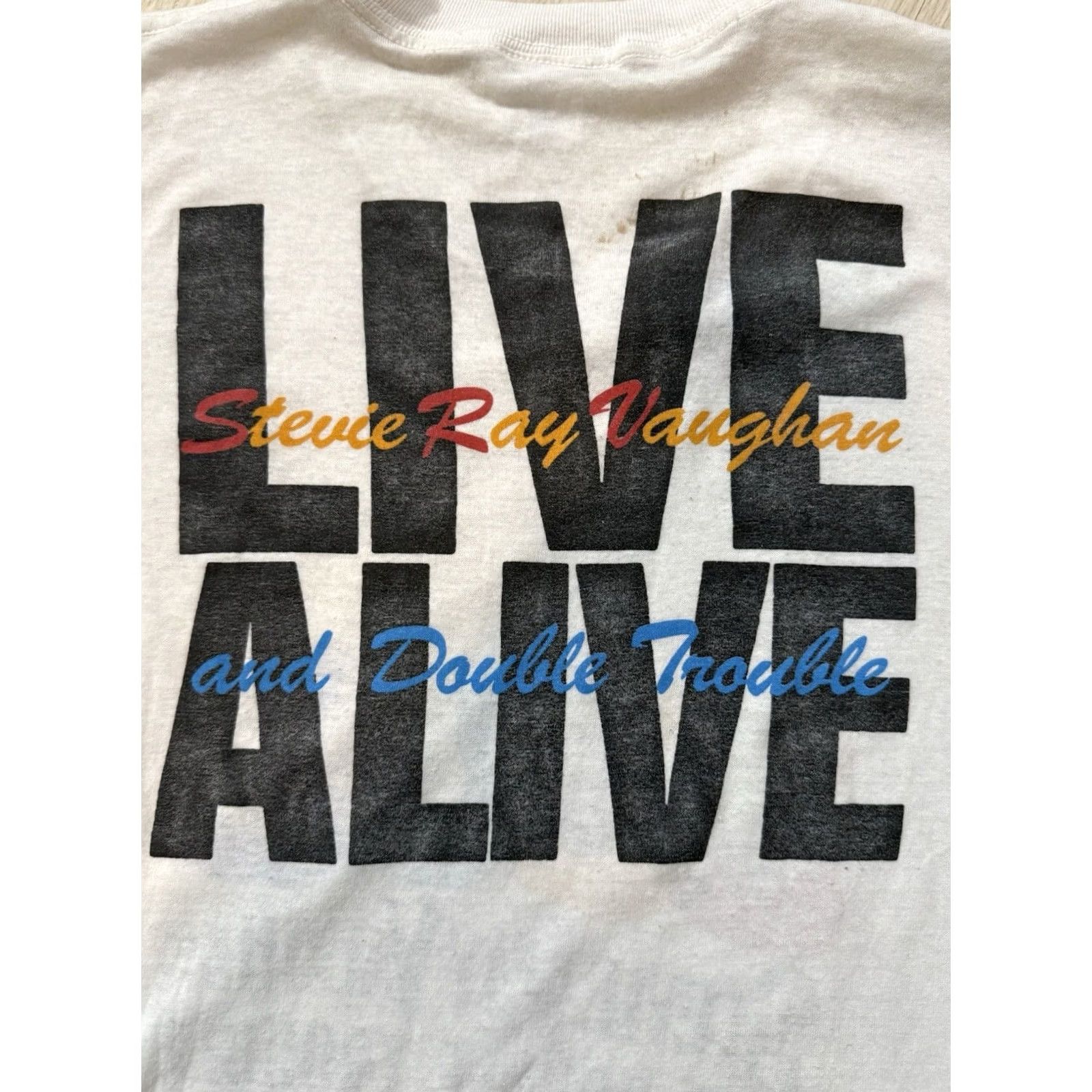 Olive VINTAGE Stevie Ray Vaughn Live Alive Shirt M/L Unisex Adults Shirt White 90s Antone Austin Texas Grand Illusion Mens Womens Boys Girls Size US M / EU 48-50 / 2 - 4 Thumbnail