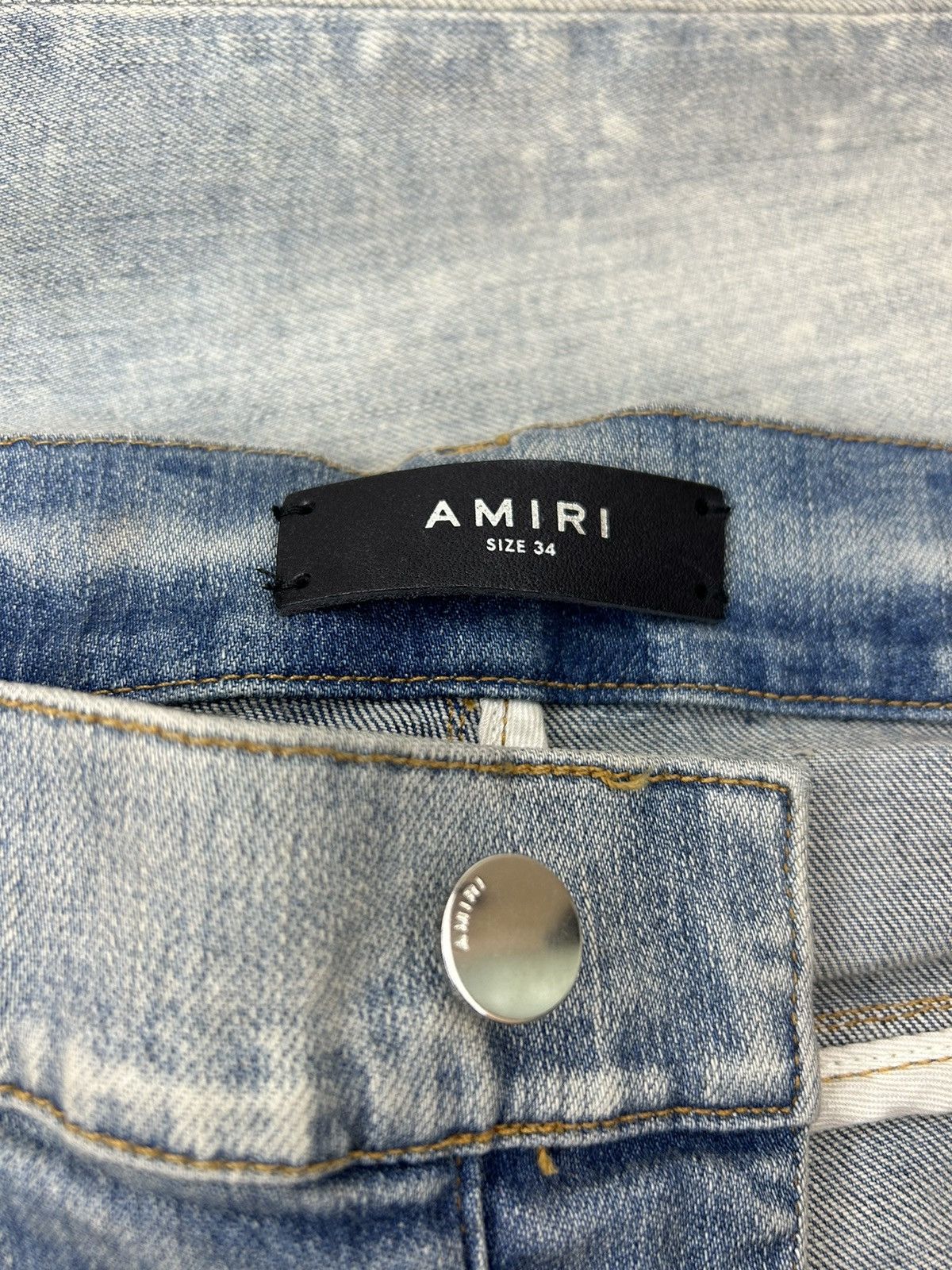 AMIRI MX1 CRACKED PAINT JEANS - CLAY INDIGO/PINK