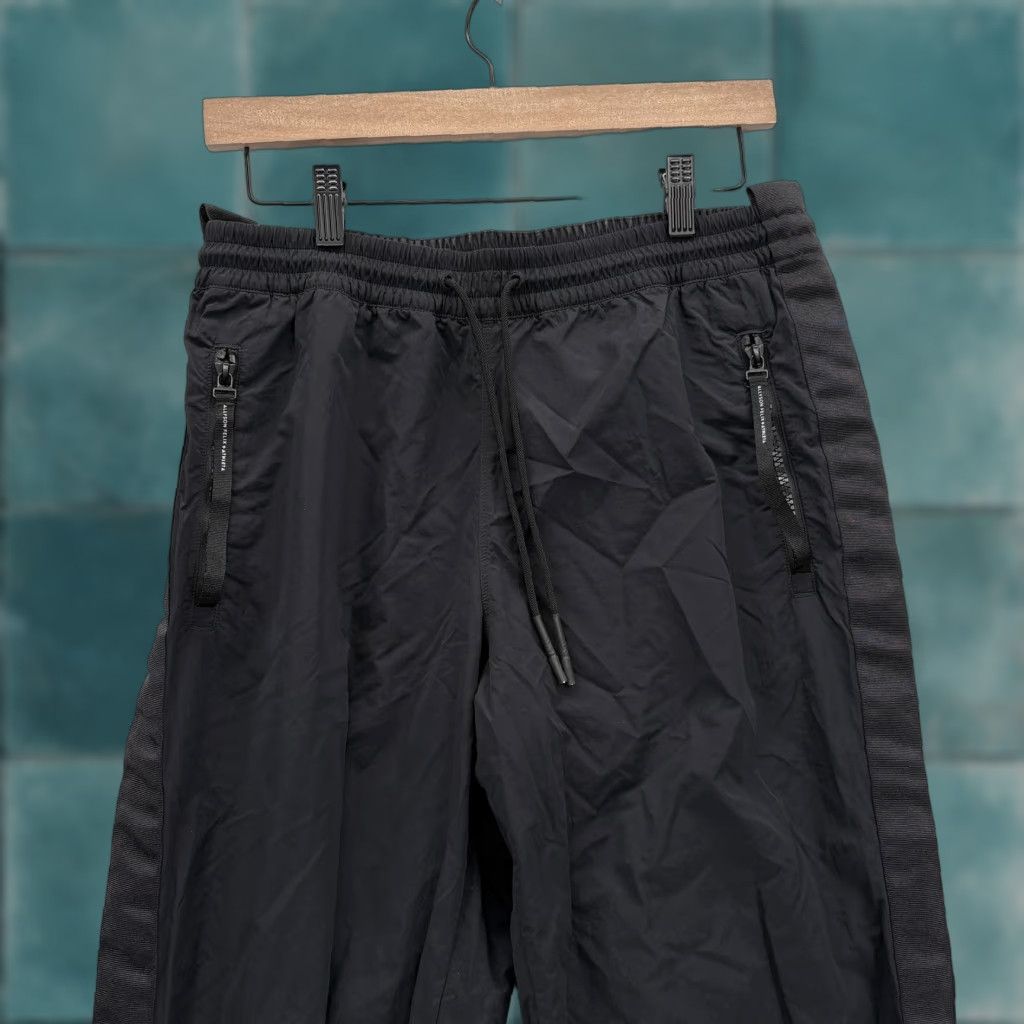 Athleta Athleta Womens Legend Track Pant Small Tall Black Nylon Drawstring Pants Slim Elastic Waist Pockets Side Stripe Zip Pocket Athletic Activewear Women Size 28" / US 6 / IT 42 - 1 Thumbnail