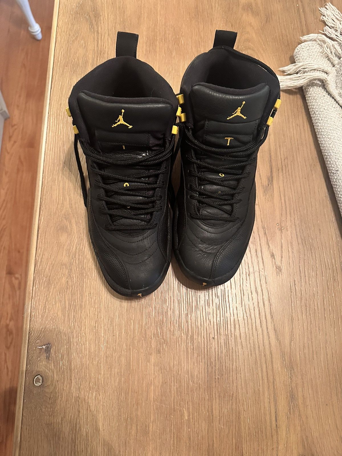 image of Jordan Brand 12 Black Taxi Shoes, Men's (Size 10)