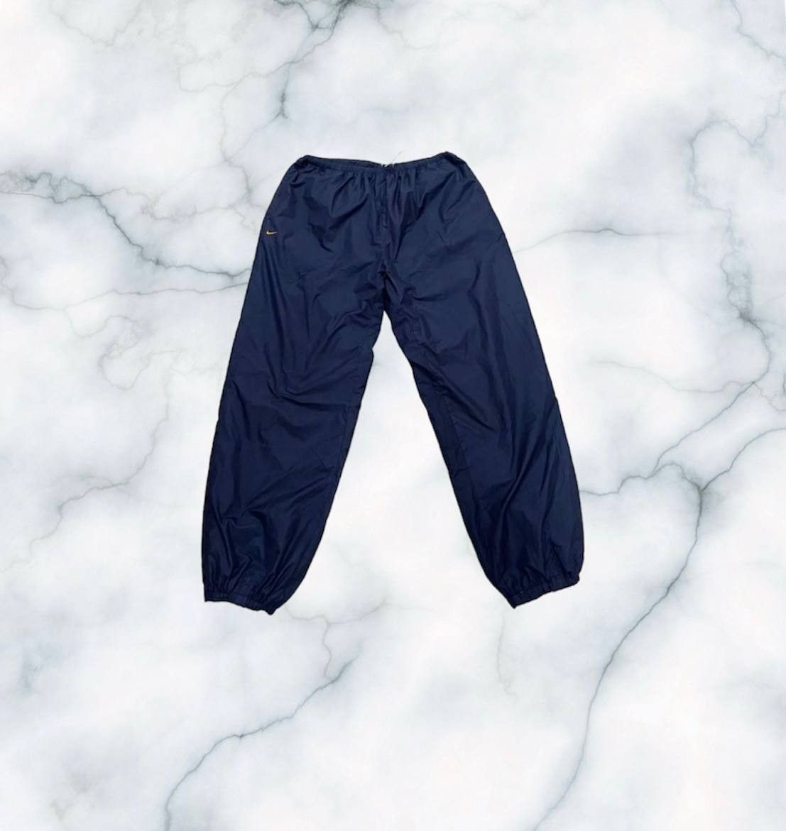 image of 90's Vintage Nike Track Pants Orange Swoosh Nike Pants in Navy, Men's (Size 34)