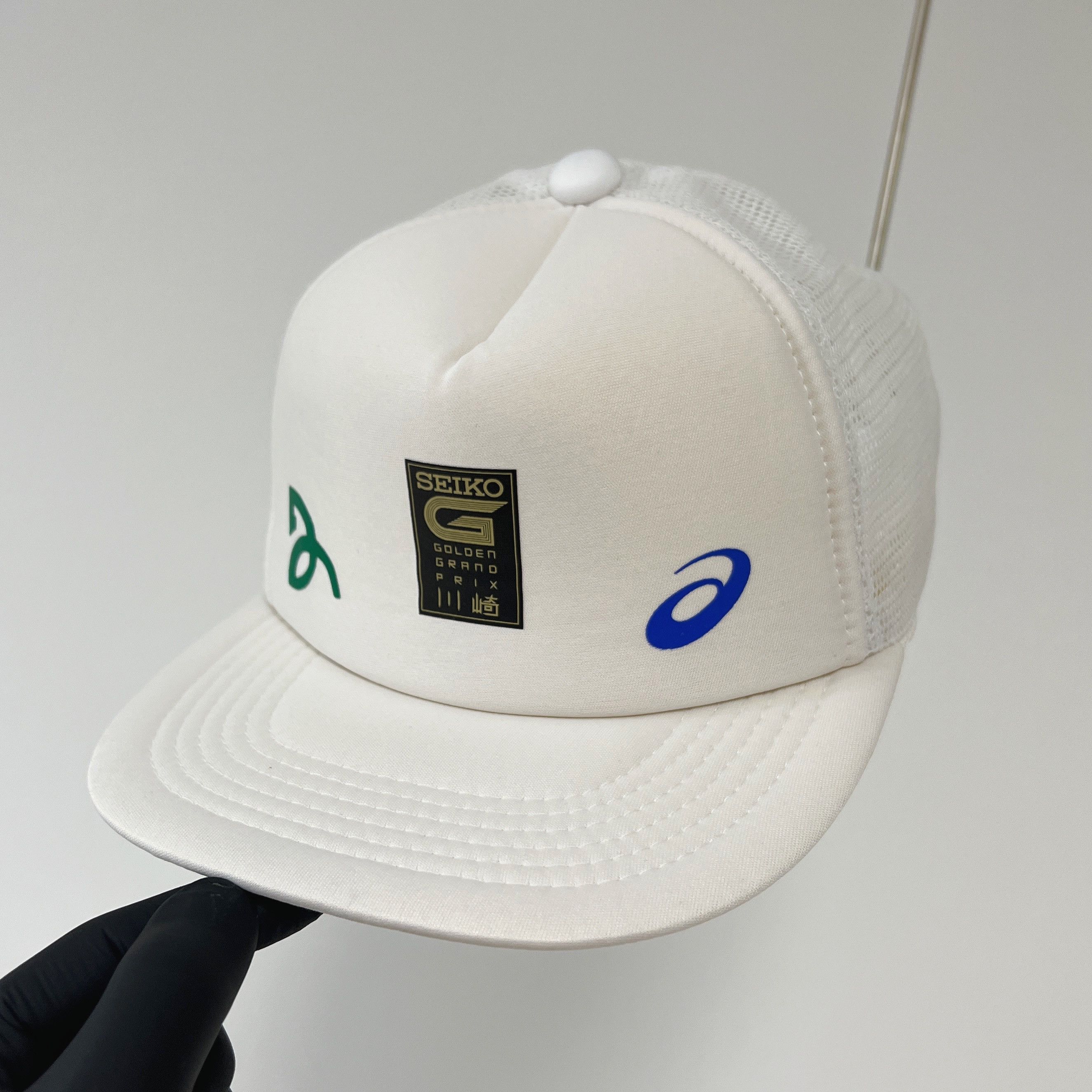 Asics Novak Seiko Golden Grand Prix Trucker Cap