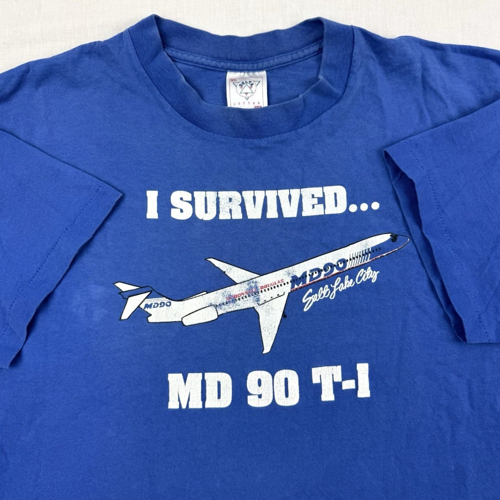 Delta VINTAGE Delta MD 90 T Shirt Adult XL I Survived MD 90 Salt Lake City Men T-Shirt Blue Cotton Short Sleeve Crew Neck 90s City Airplane Gir.. Size US XL / EU 56 / 4 - 2 Thumbnail
