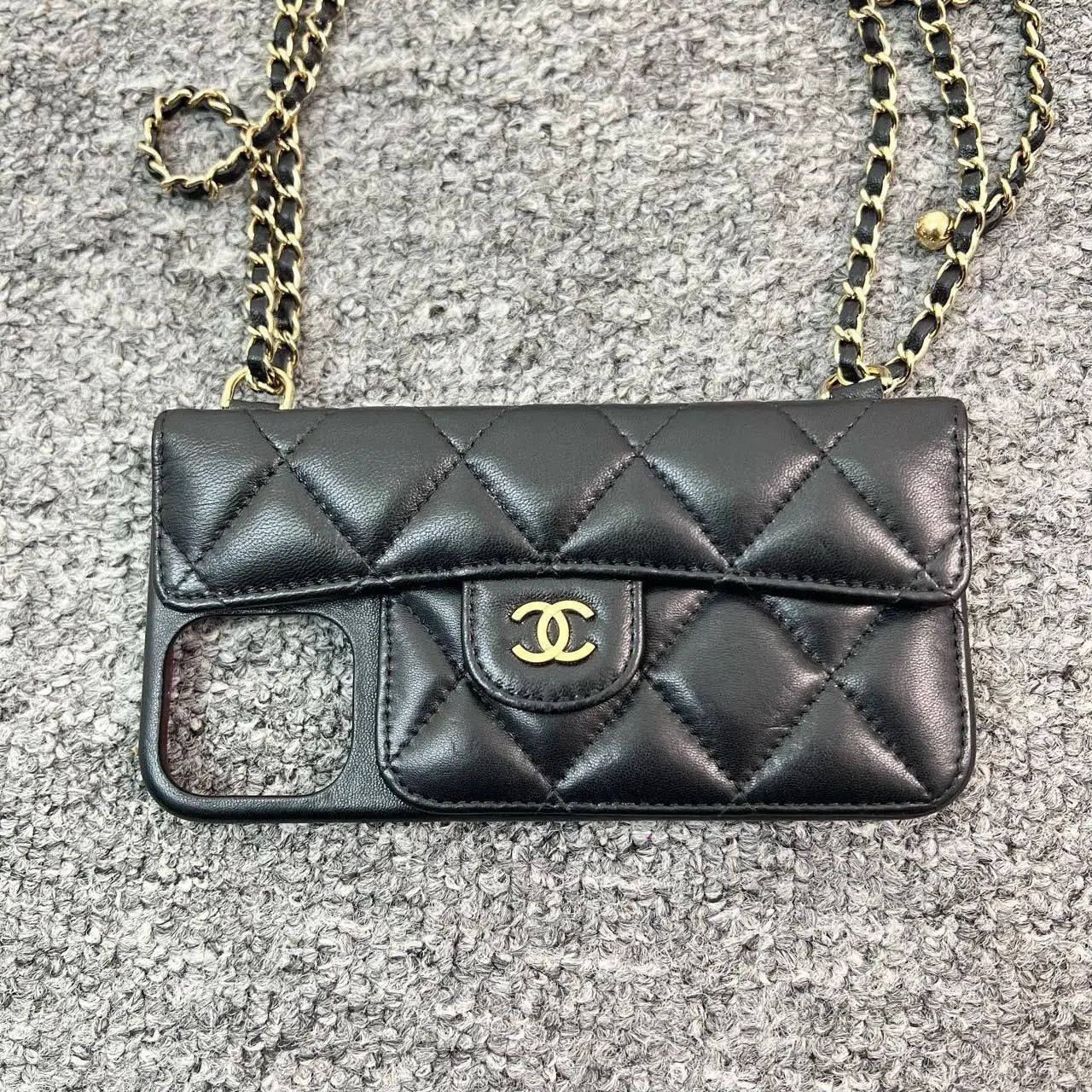 Chanel Chanel Black Lambskin Gold Ball Chain Phone Case. Size ONE SIZE - 1 Thumbnail