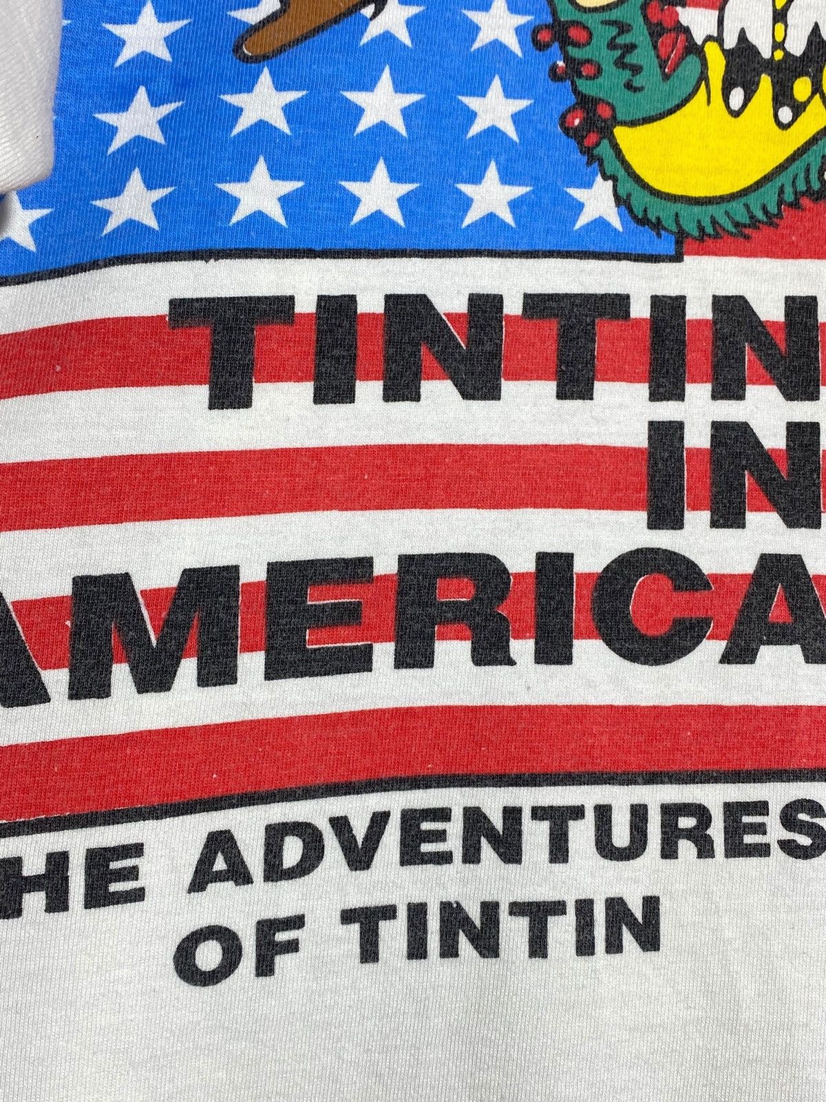 Cartoon Network 🔥 TINTIN IN AMERICA 90s GRAPHIC TEE USA INDIGENOUS VIBES Size US M / EU 48-50 / 2 - 5 Thumbnail