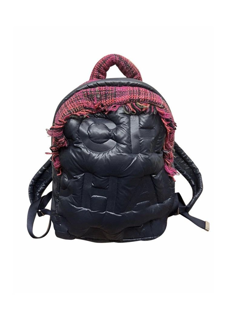 image of Chanel Nylon Doudoune Tweed Logo Embossed Puffer Backpack in Black, Men's