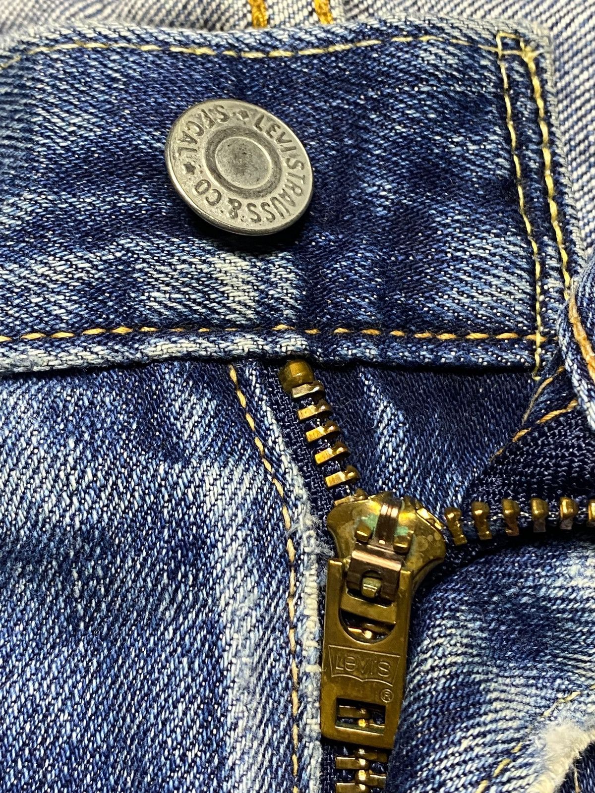 Vintage Levis 502 Blue Wash Ripped Straight Jeans