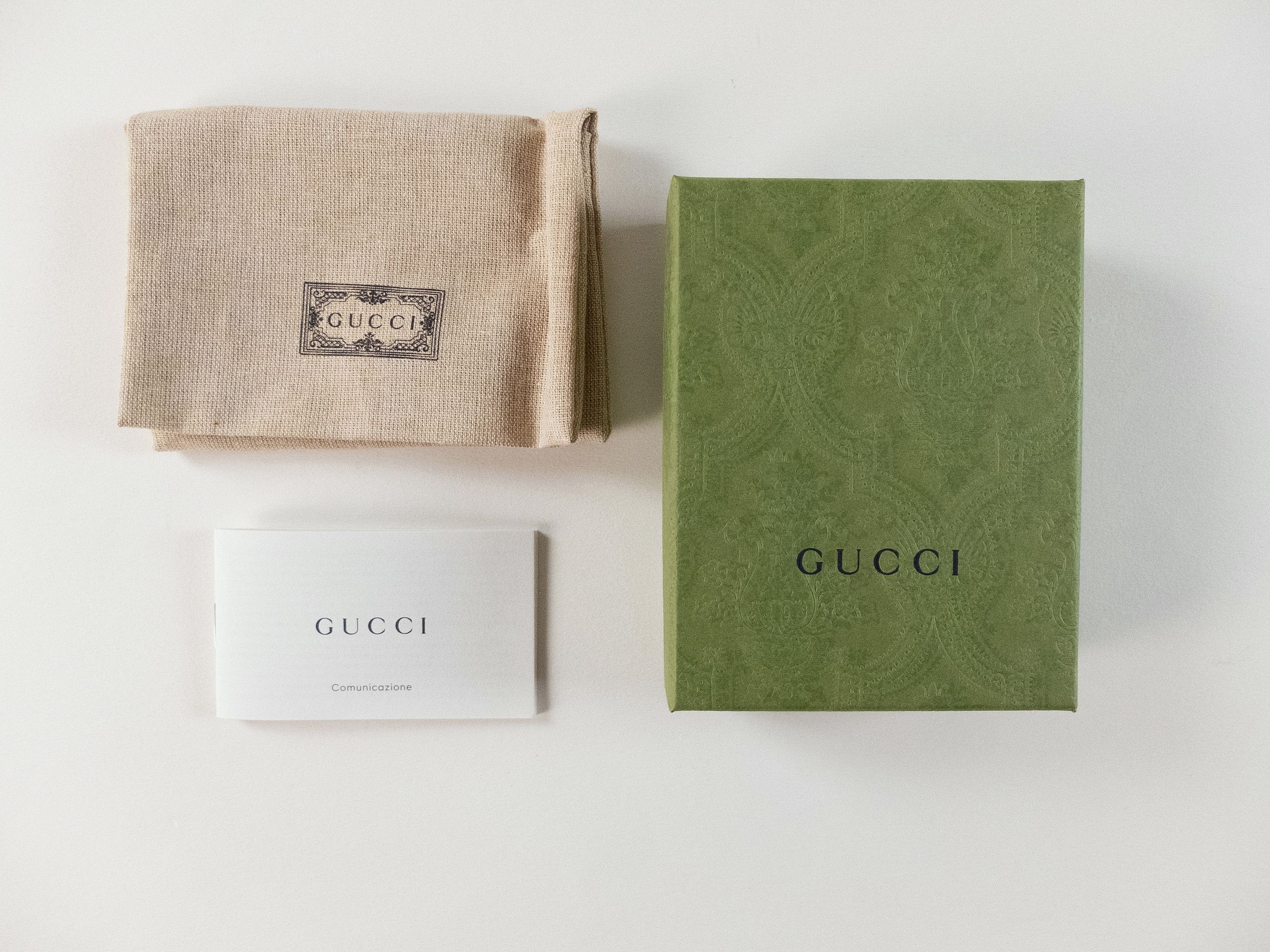 GUCCI gold tone enameled interlocking G logo metal keyring