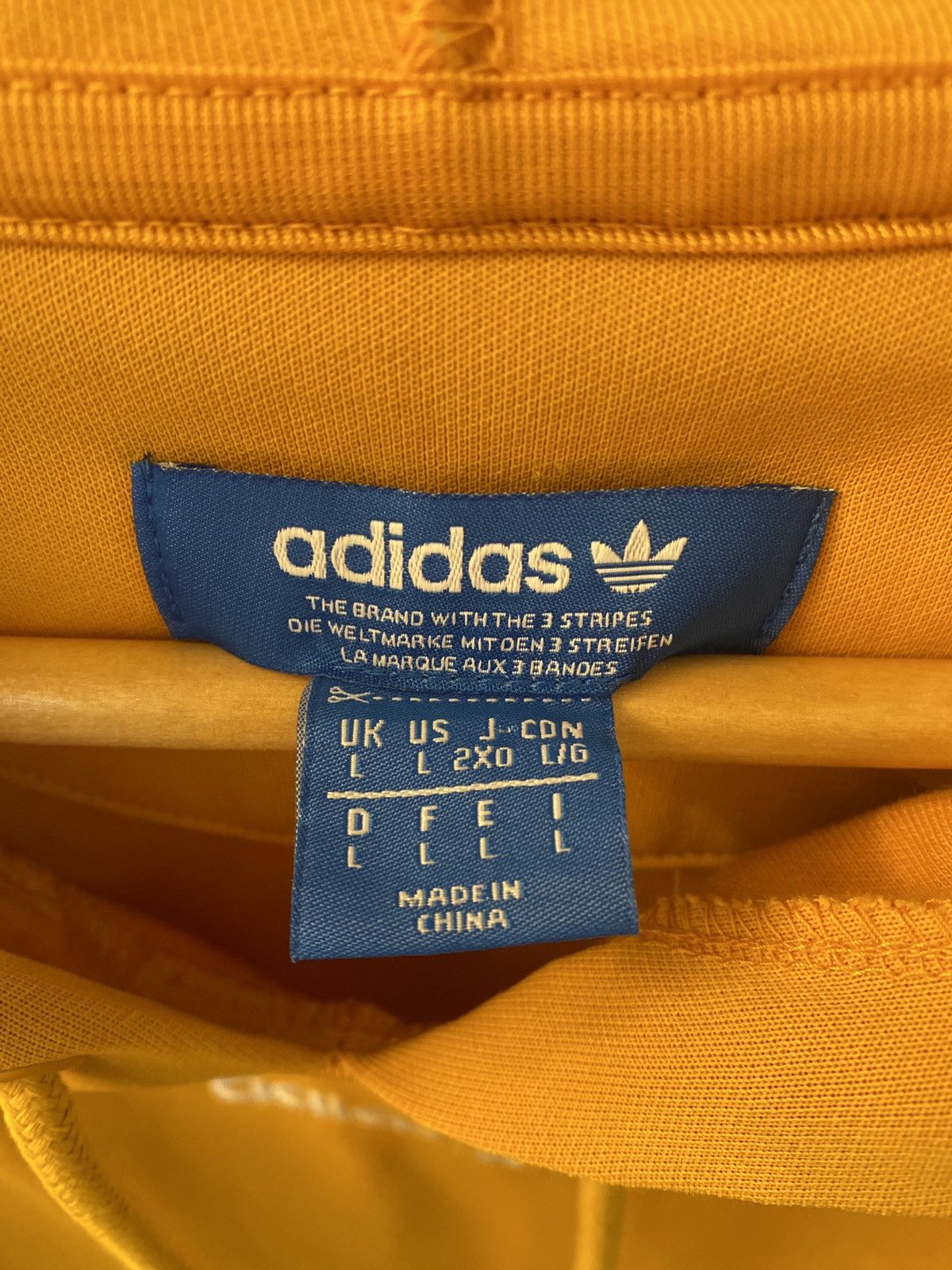 Adidas yellow tnt tape hoodie online