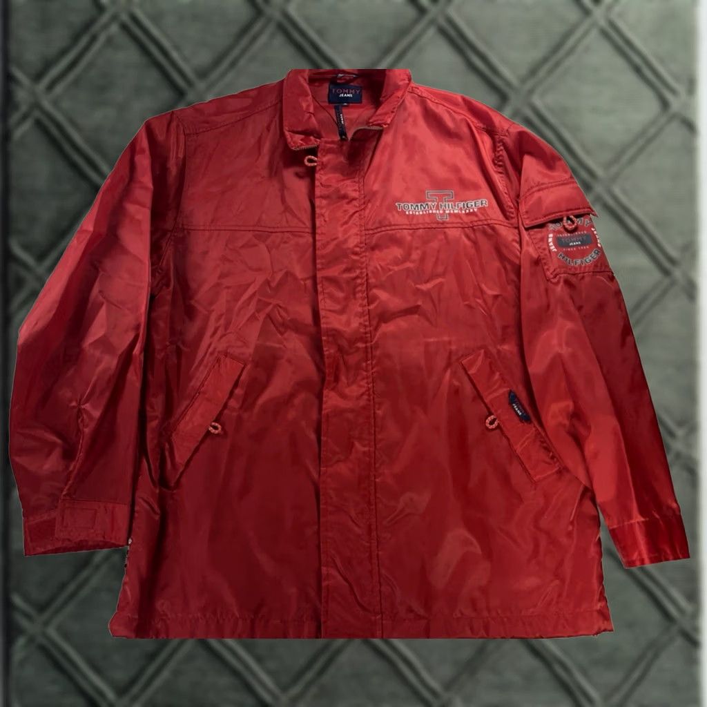 Tommy Hilfiger VTG Tommy Hilfiger Jeans Jacket Mens Medium Red Logo Windbreaker Hooded Nylon Front Zip Button Snap Sailor Windbreaker *Flaw" Size US 31 - 1 Thumbnail