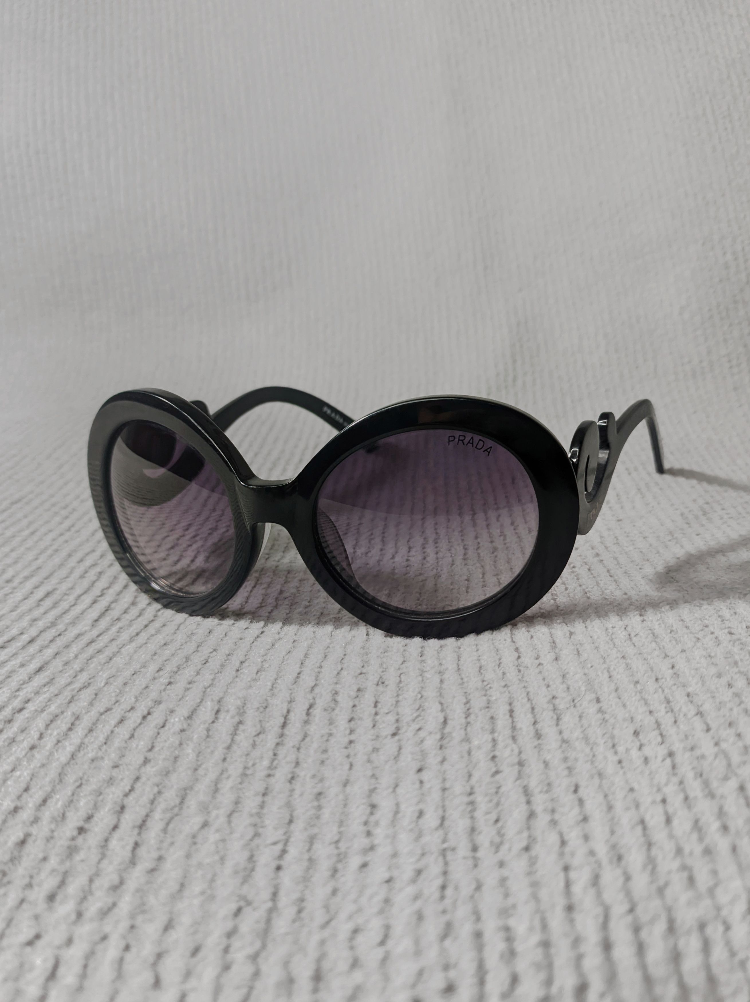 Prada Baroque Swirl Round Black Sunglasses - Main Image