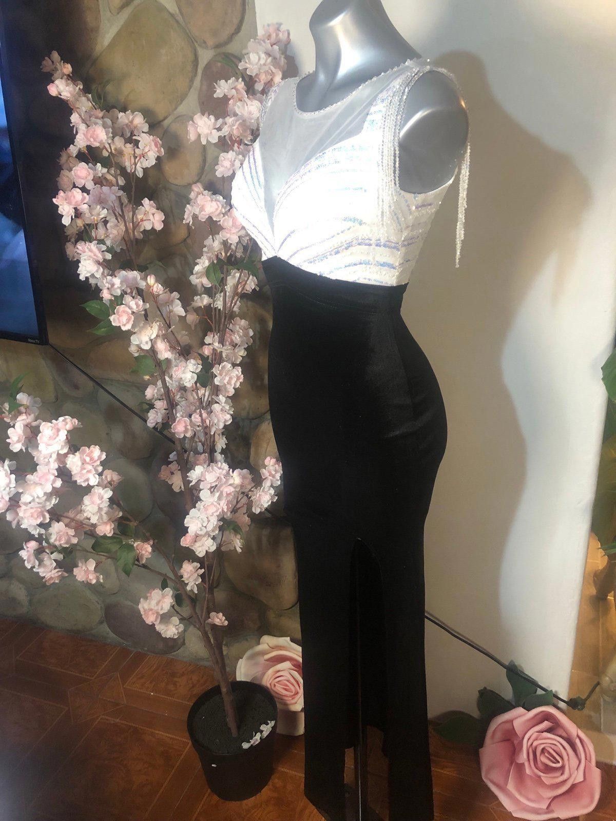 black bottom white top dress 17 Black-and-White Two-Tone Dresses That Elegant Women Swear By flare silhouette Black And White Dresses |