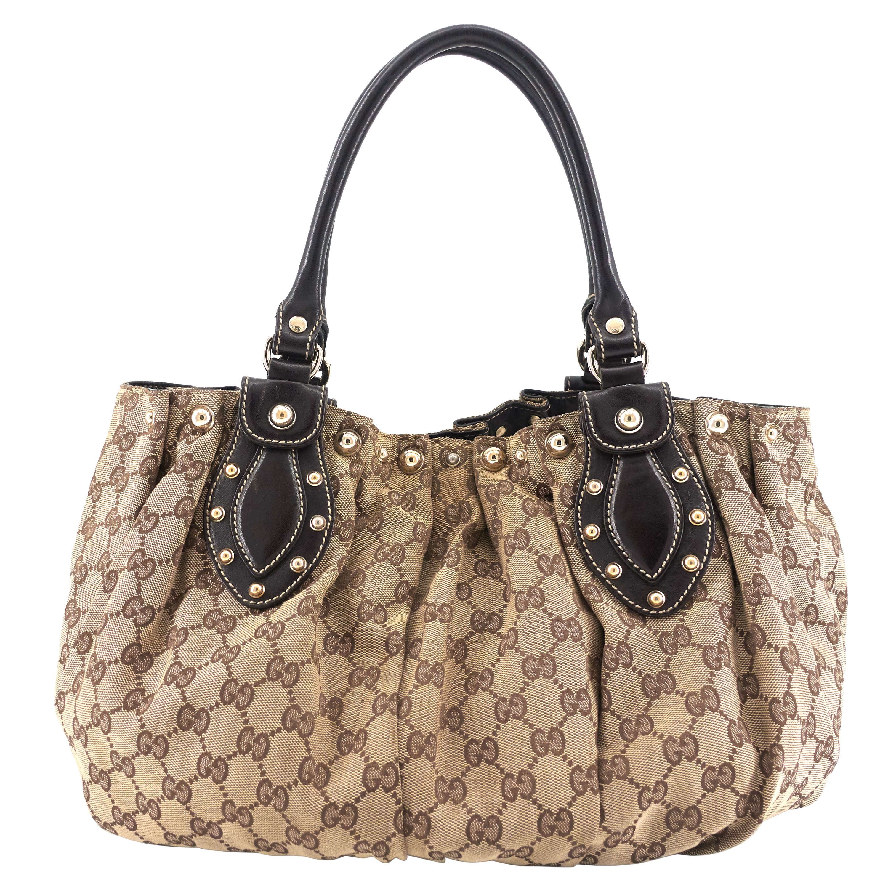 image of Gucci Pelham Medium Monogram Canvas Studded Hobo Bag in Brown, Women's
