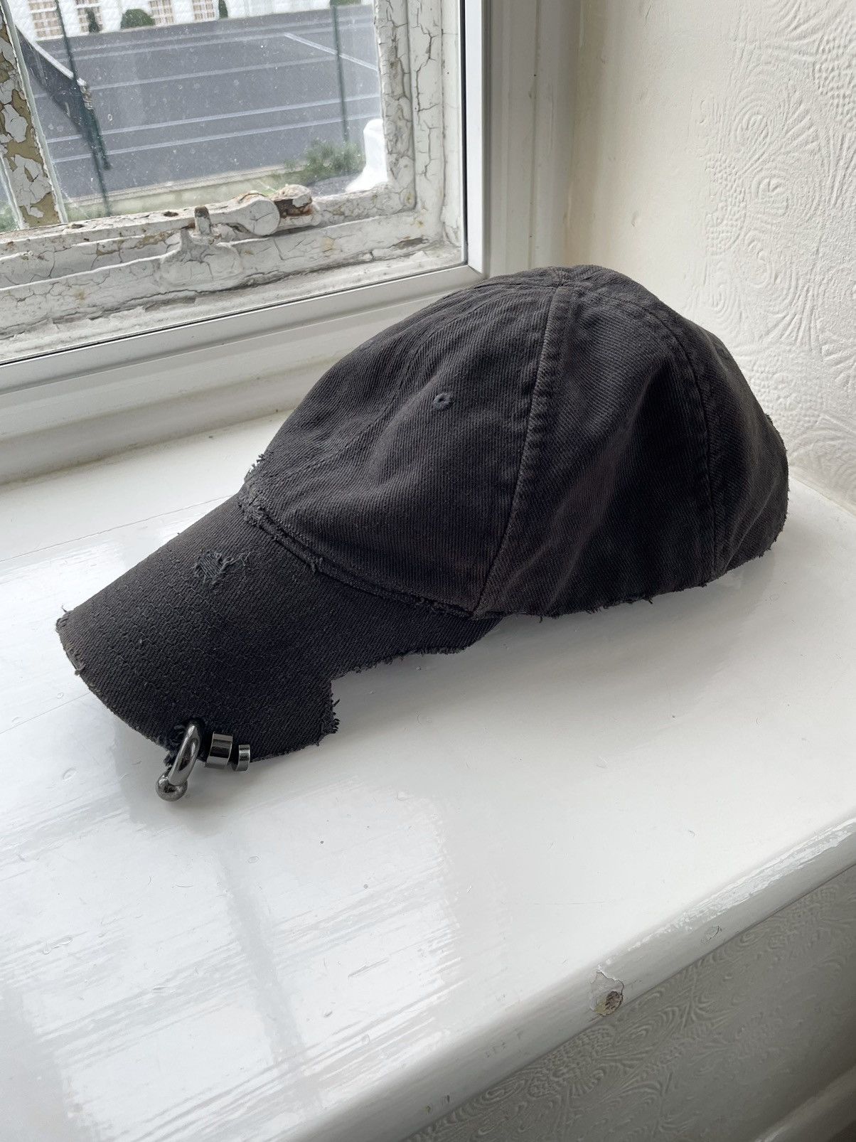 Balenciaga MUD SHOW HEAVY PIERCING CAP (L) | Grailed