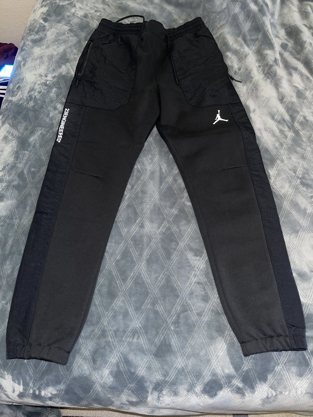 image of Air Jordan 23 Engineered Fleece Pants in Black, Men's (Size 31)