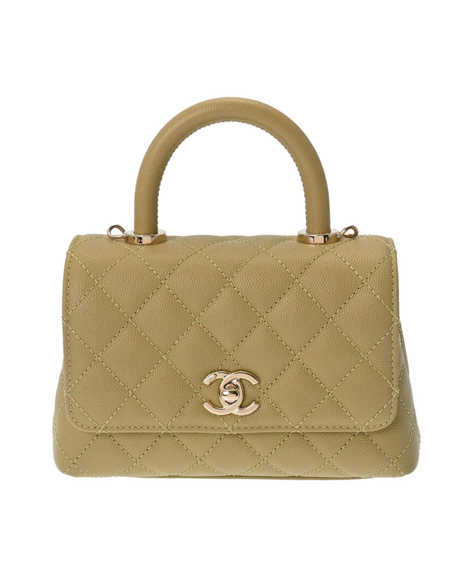 image of Chanel Sophisticated White Leather Handbag With Turn Lock Closure in Beige, Women's