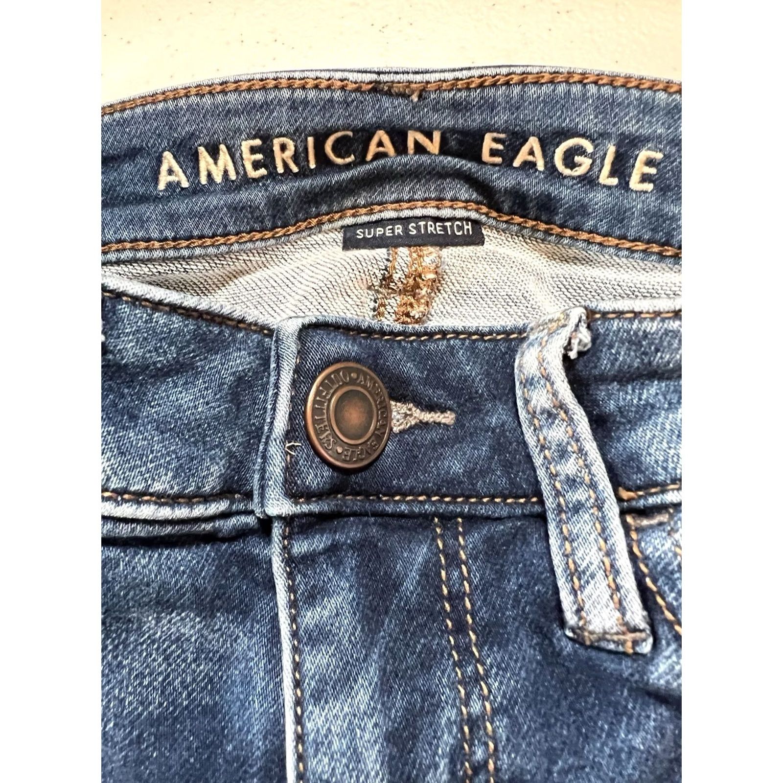 American Eagle Outfitters American Eagle Outfitters Jegging Womens 00 Blue Denim Distressed Button Mid Rise 26.5in Inseam Regular Stretch Comfort Pockets Medium Wash Size 24" / US 00 / IT 34 - 4 Thumbnail