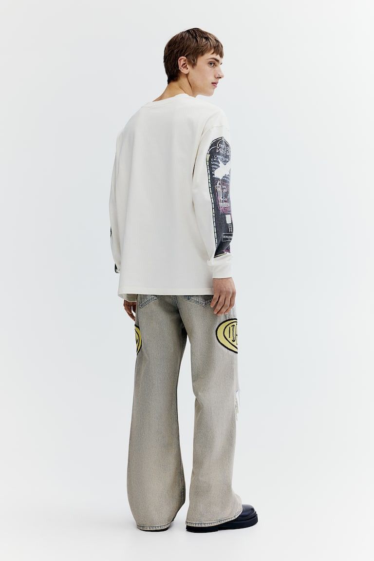 H&M × Jean-Michel Basquiat × Who Decides War Who Decides War bootcut loose jeans H&M x Basquiat x Ev&Tela Size US 31 - 18 Thumbnail