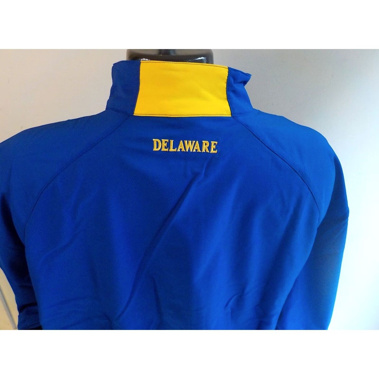 Under Armour UNDER ARMOUR Allseason Jacket Mens 2XL Zip Front Rain Blue Gold NWT Windbreaker Casual Front Zip Pockets UD Chest Back Neck DELAWARE, USA Size US XXL / EU 58 / 5 - 4 Thumbnail