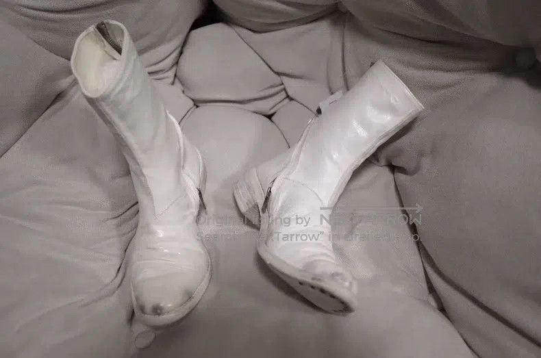 Carol Christian Poell Boots are dark and white
