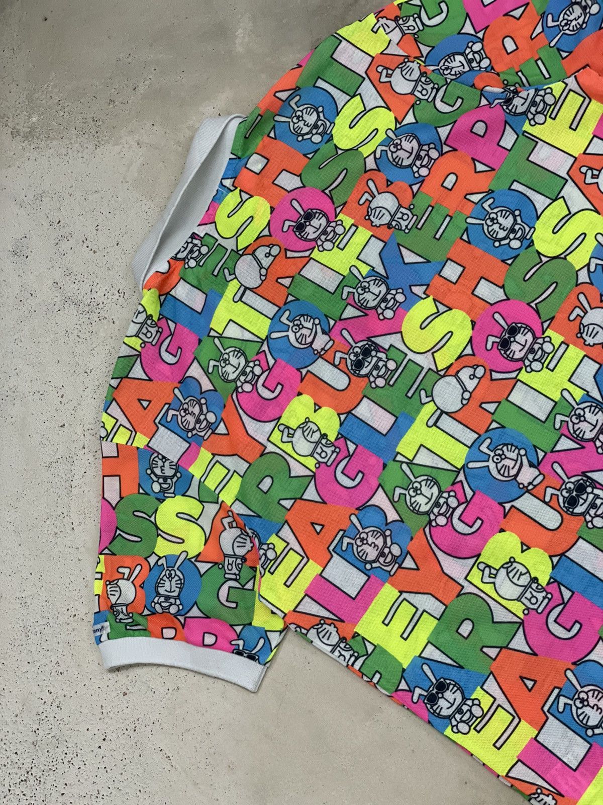 Anime × Japanese Brand × Psycho Bunny Jack Bunny Doraemon Polo Fullprint Wording Colorful Size US L / EU 52-54 / 3 - 10 Thumbnail