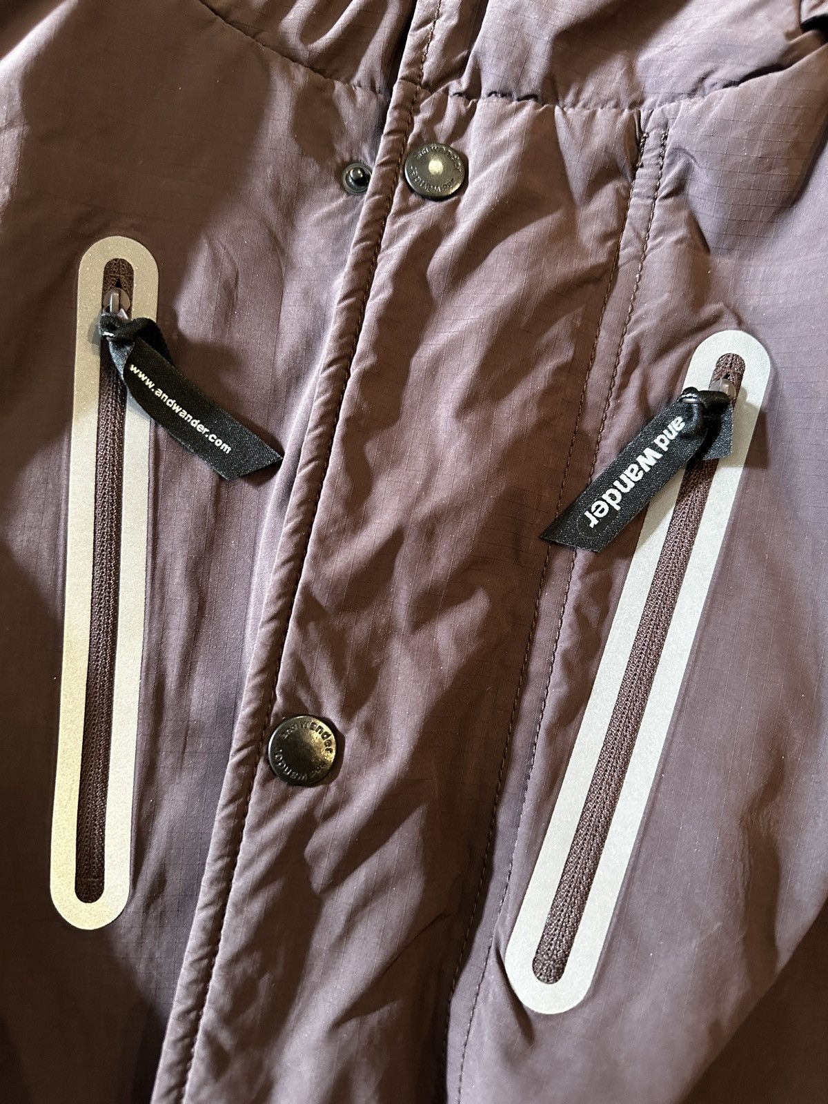 And Wander and wander Octa Jacket in Brown, size L/XL Size US L / EU 52-54 / 3 - 18 Thumbnail