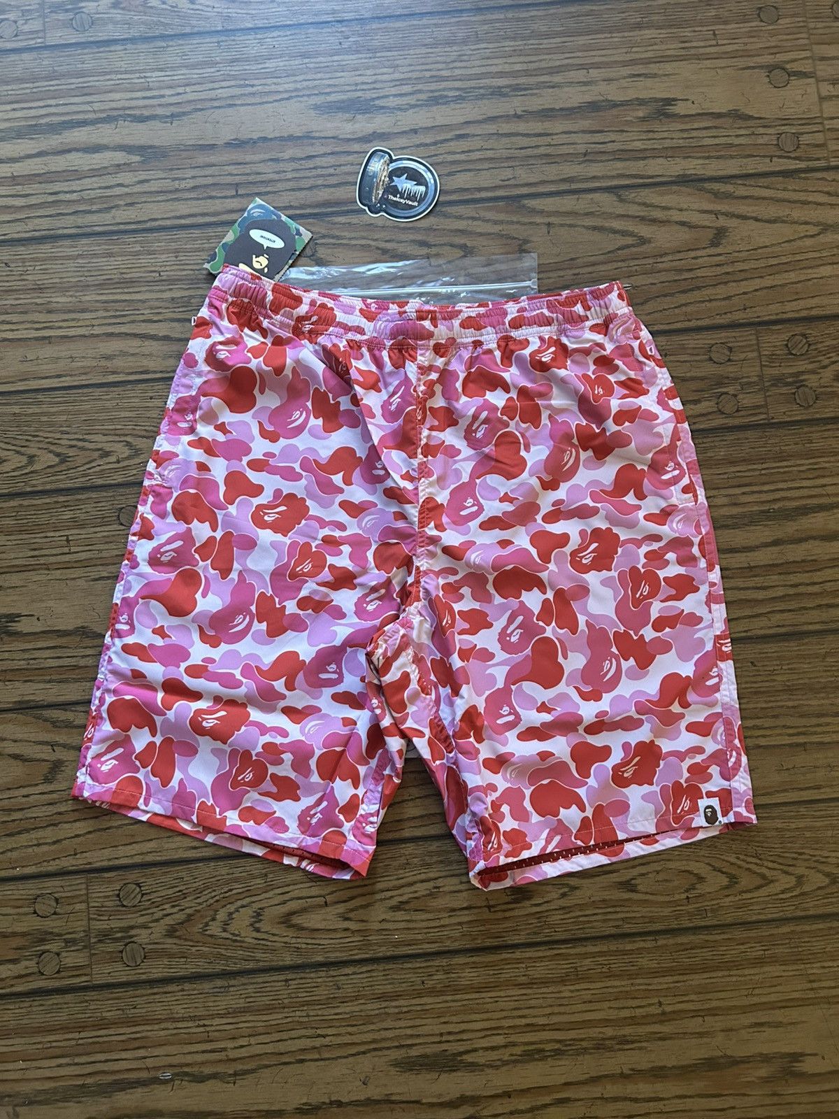 ウェア BAPE PINK ABC CAMO SHORT BEACH PANTS BAPE PINK ABC CAMO SHORT BEACH PANTS（Pink Camou Baggy Mesh