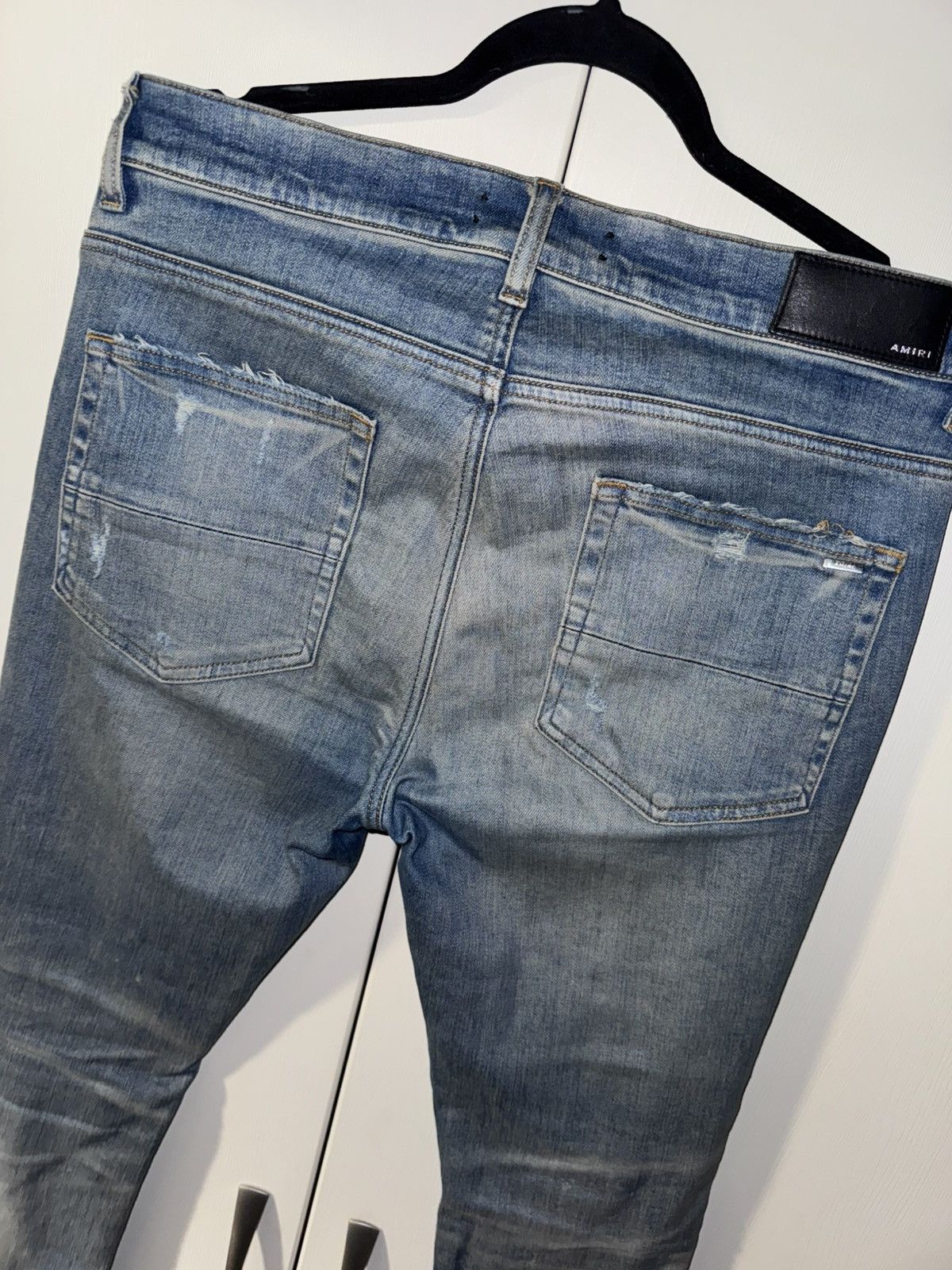 AMIRI BLUE DISTRESSED JEANS