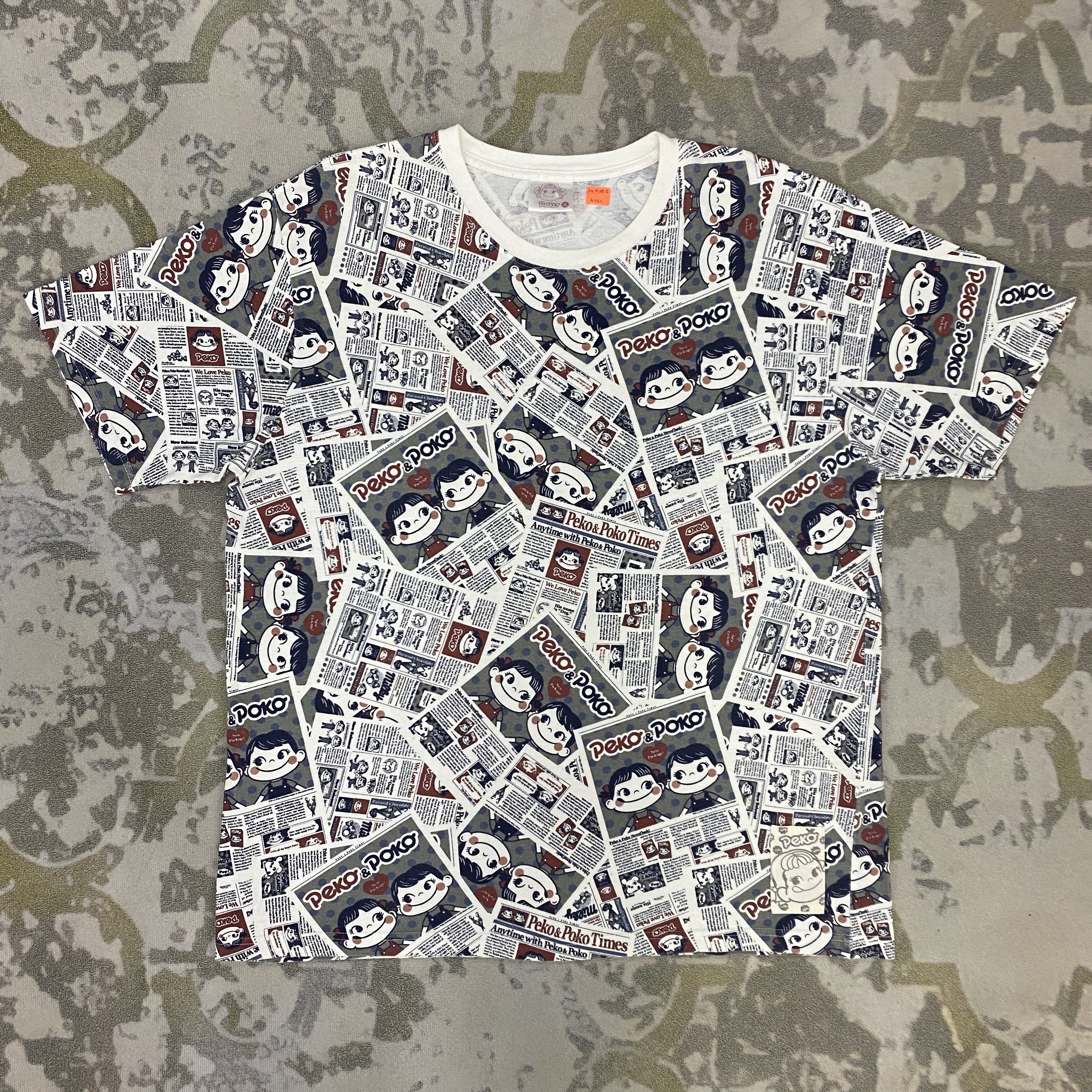 Japanese Brand Vintage Peko-chan Newspaper Pattern T-Shirt - K081 Size US XL / EU 56 / 4 - 1 Thumbnail
