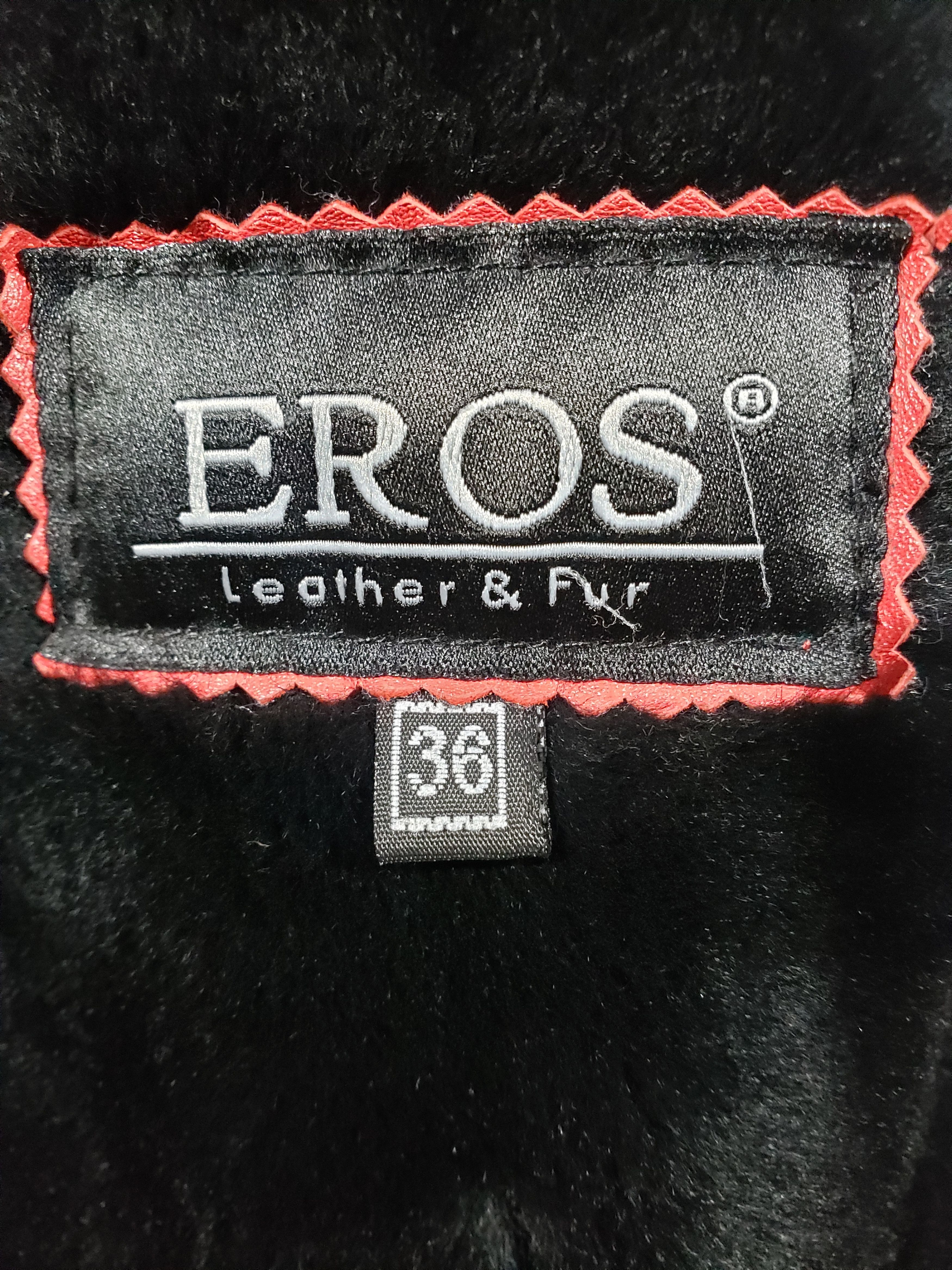 Stylish women's red sheepskin coat with a hood. Fur Faux Fur