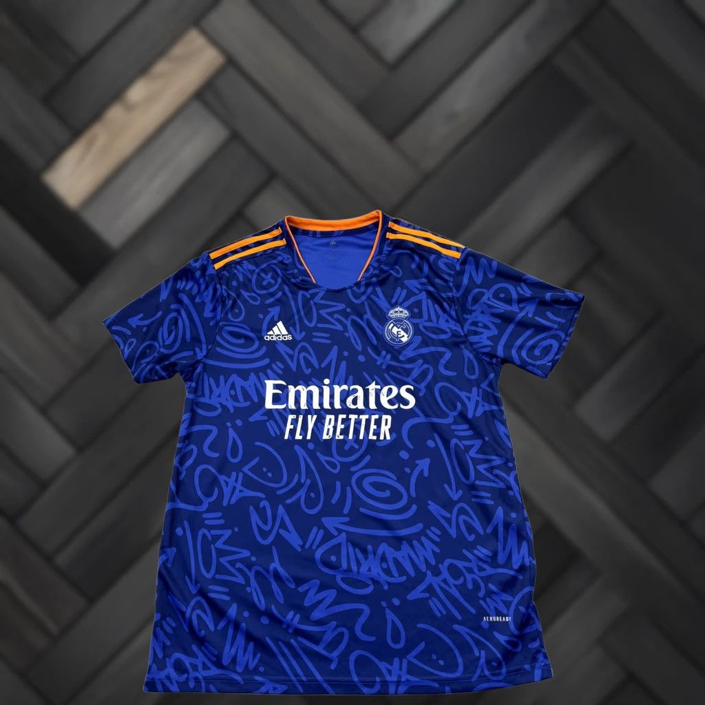 Adidas Adidas Real Madrid Graffiti Jersey XL Victory Blue 2021 PRIMEGREEN Jersey Unisex Adult XL Victory Blue Graffiti 2021 PRIMEGREEN Size US XL / EU 56 / 4 - 1 Thumbnail