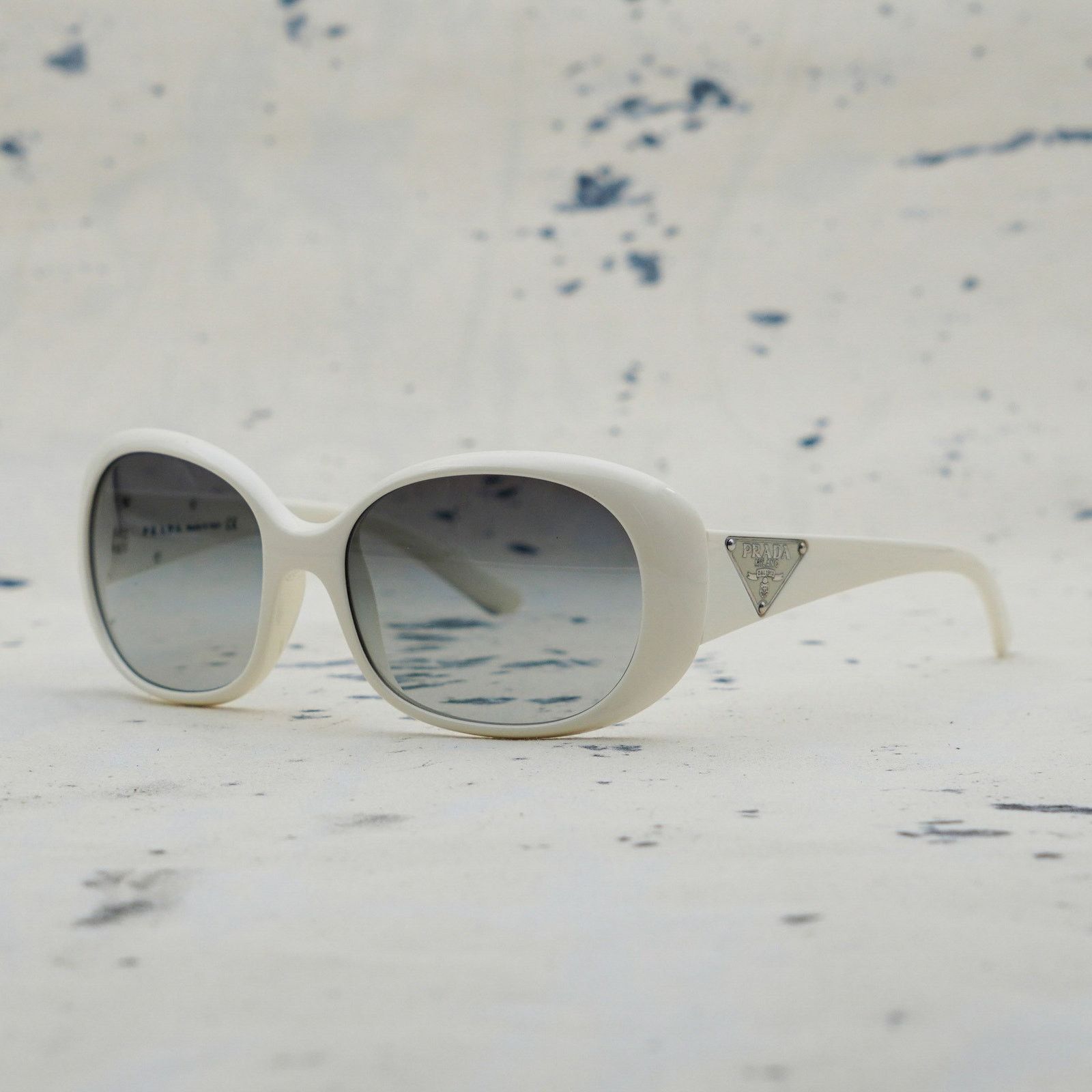 Prada milano spr 27l triangle logo white oval sunglasses