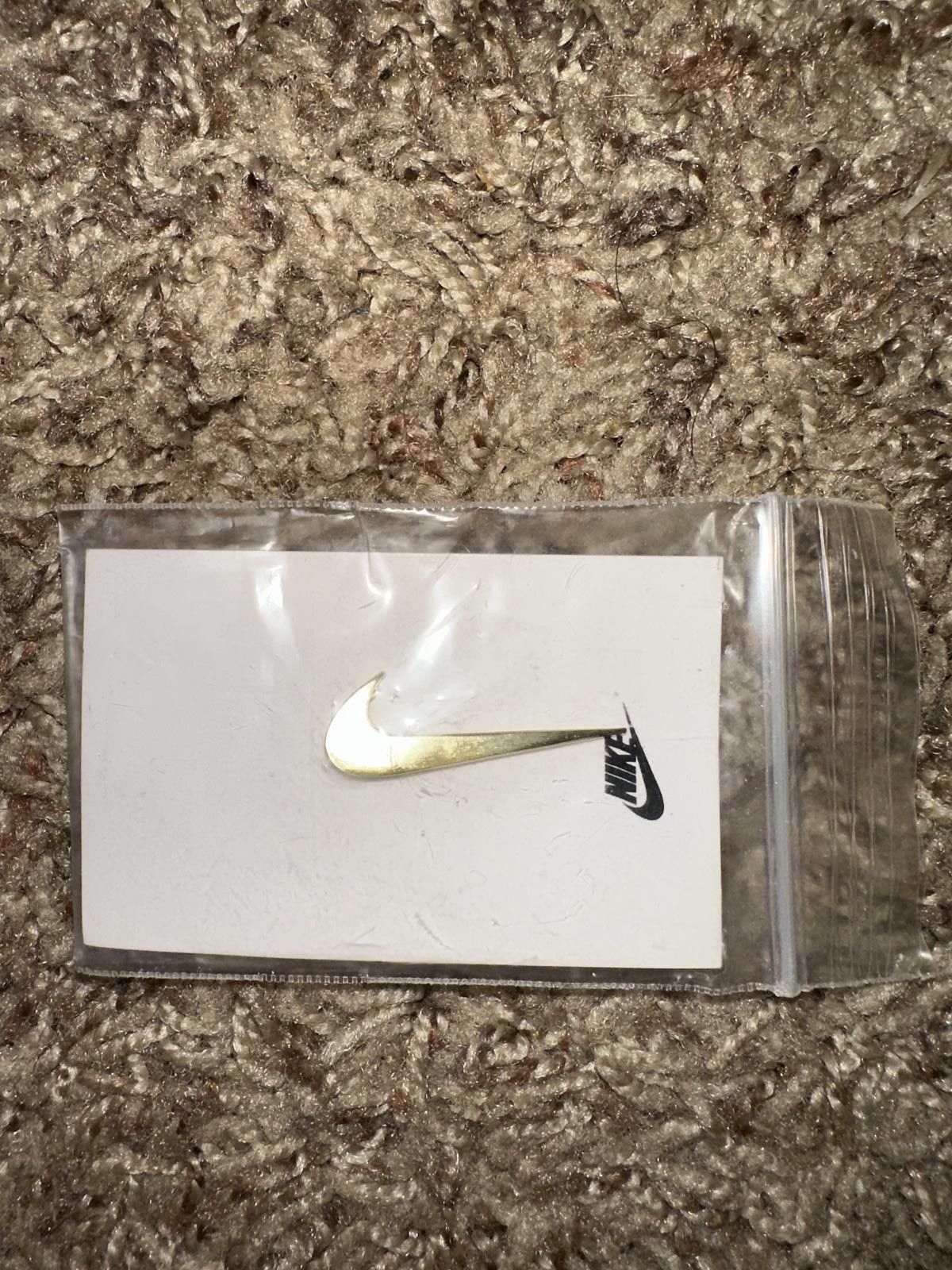 Nike Nike Metallic Gold Swoosh Logo Pin Size ONE SIZE - 1 Thumbnail