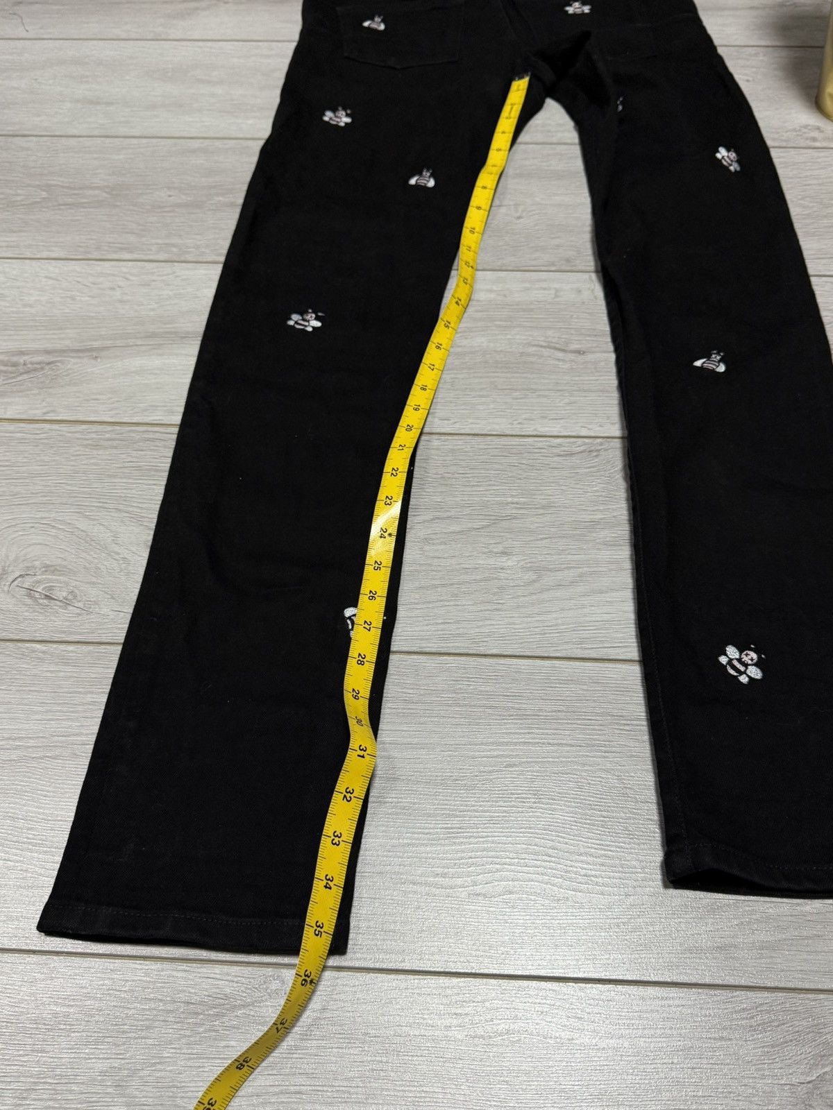 Dior × Kaws Dior x Kaws bugs slim jeans pants all over buttons Size US 33 - 16 Thumbnail