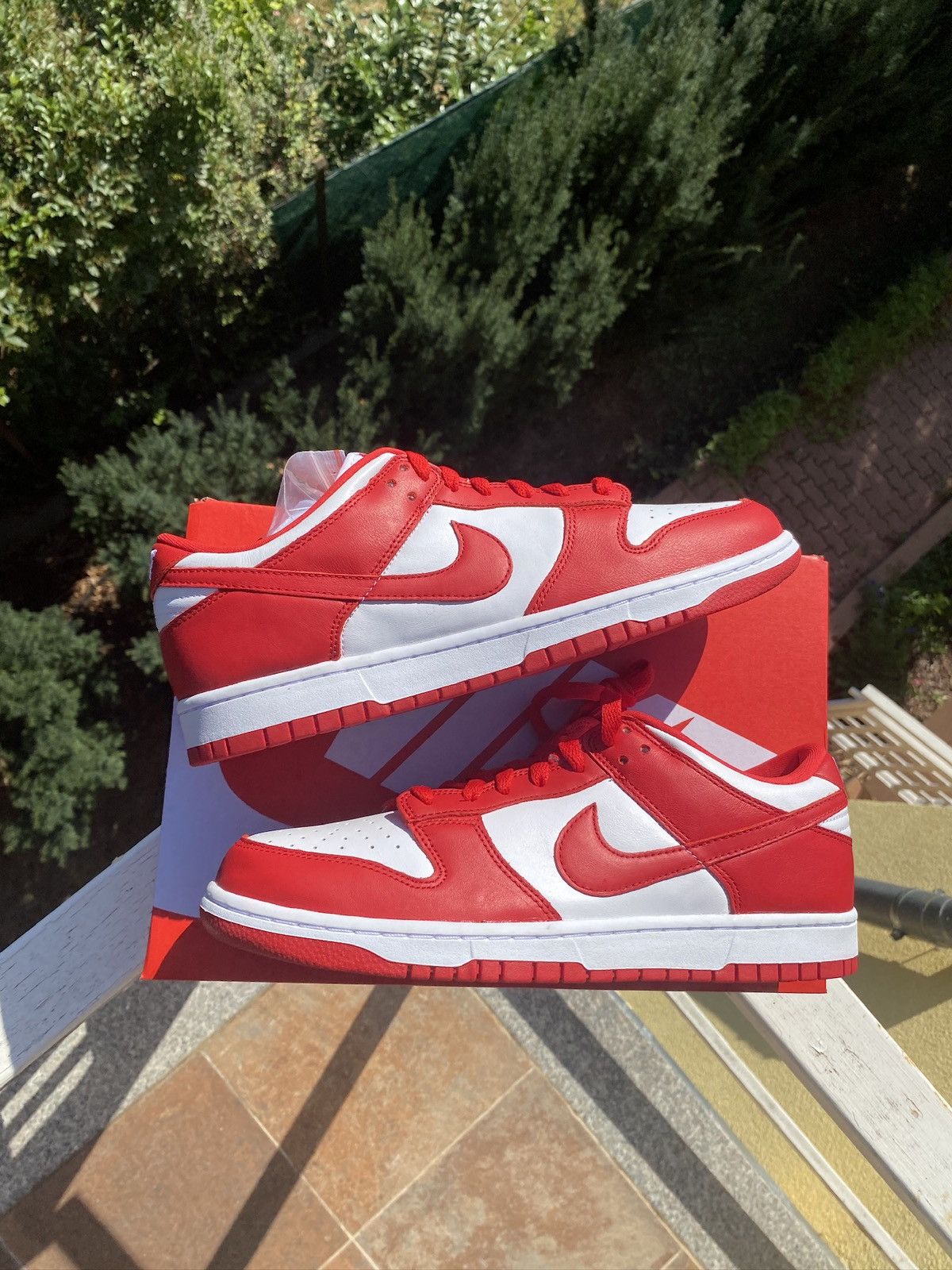 image of Nike Dunk Low Sp St. John’S Shoes in University Red, Men's (Size 10.5)