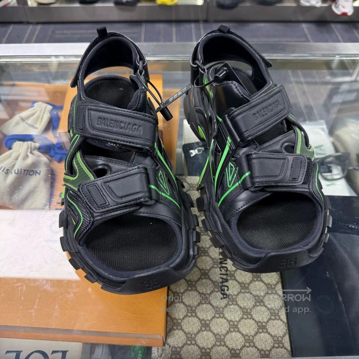 balenciaga track sandals in black and green.