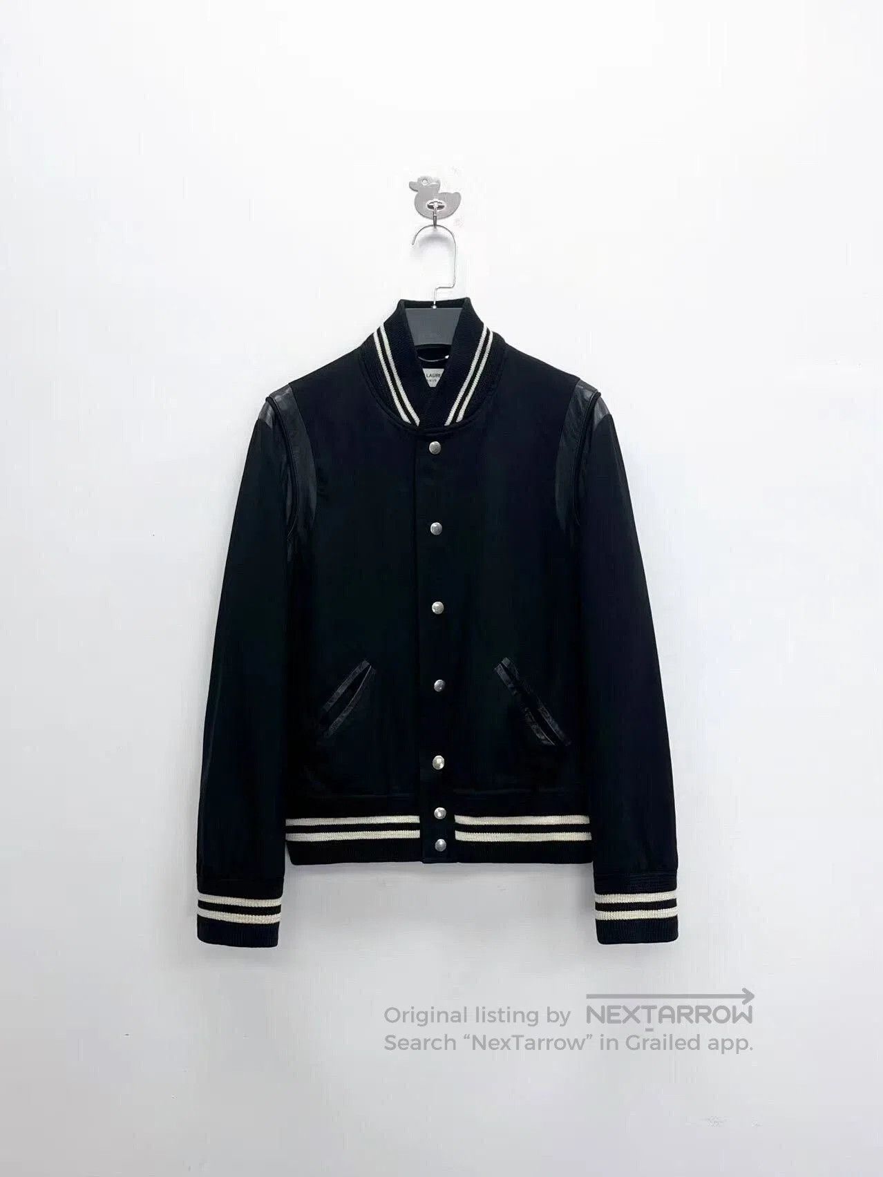black and white striped baseball jacket.